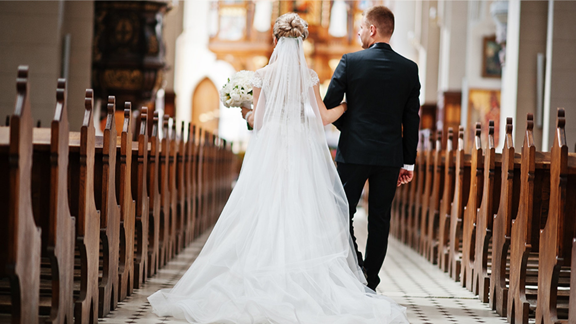 Bride and groom walking down the aisle.