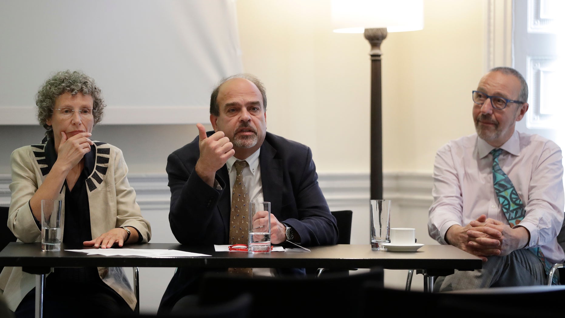 In this photo taken on Monday, Sept. 12, 2016, chief investigator Professor Freddie Hamdy, centre, and co-researchers Professor Jenny Donovan, left, and Professor David Neal, right, sit during a press briefing to announce the results of the world's first and largest trial into treatment for prostate cancer, in London. Men with early prostate cancer who choose to closely monitor their disease are just as likely to survive at least 10 years as those who have surgery or radiation, finds a major study that directly tested and compared these options. (AP Photo/Kirsty Wigglesworth)