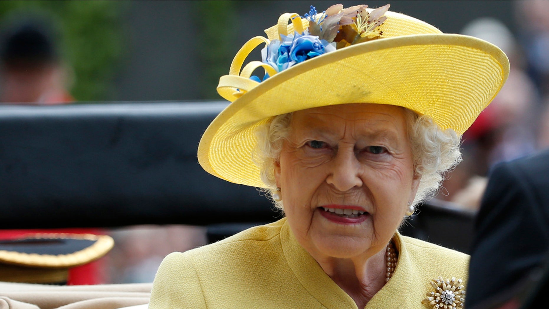 This is a Tuesday, June, 14, 2016 file photo of Britain's Queen Elizabeth II as she arrives by carriage on the first day of the Royal Ascot horse race meeting at Ascot, England.