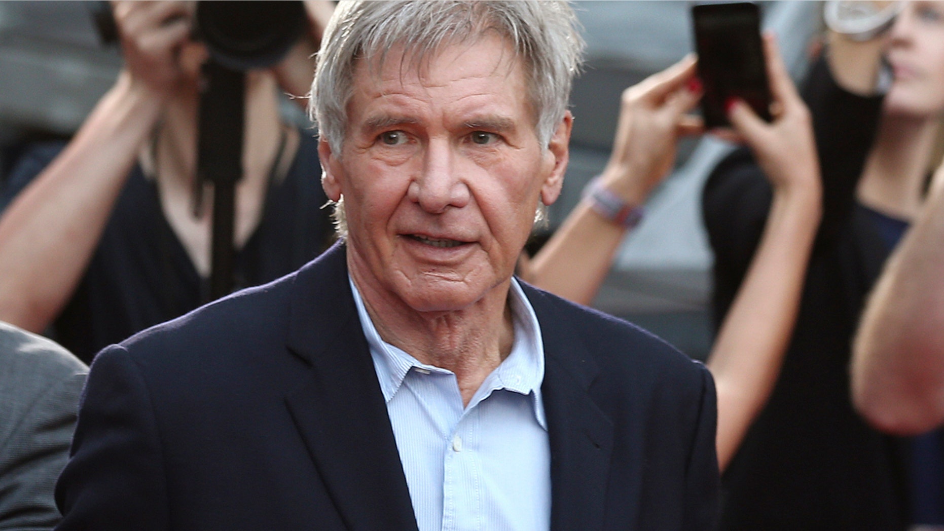 Dec. 10, 2015: Harrison Ford greets fans during a Star Wars fan event in Sydney. A film production company has been fined 1.6 million pounds ($1.95 million) over an accident on the set of "Star Wars: The Force Awakens" that broke the leg of star Harrison Ford.