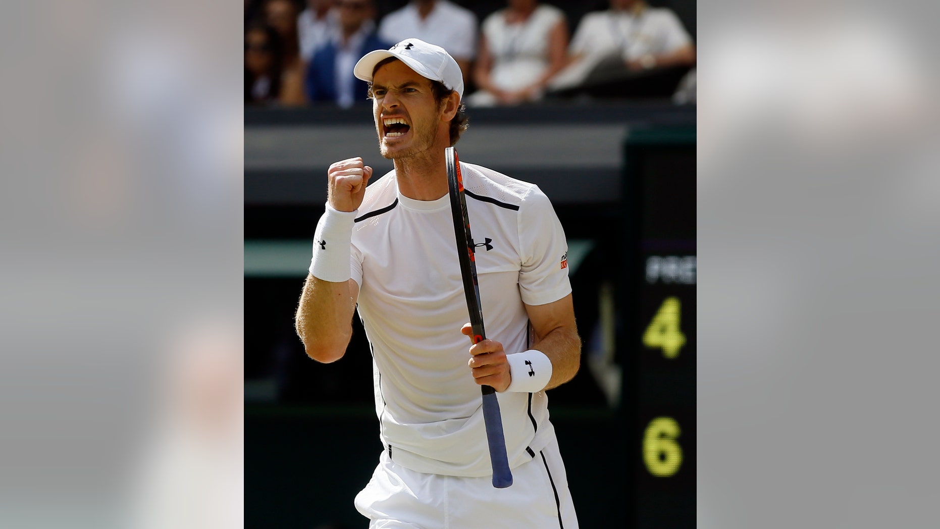 Andy Murray celebrates winning the second set against Milos Raonic.