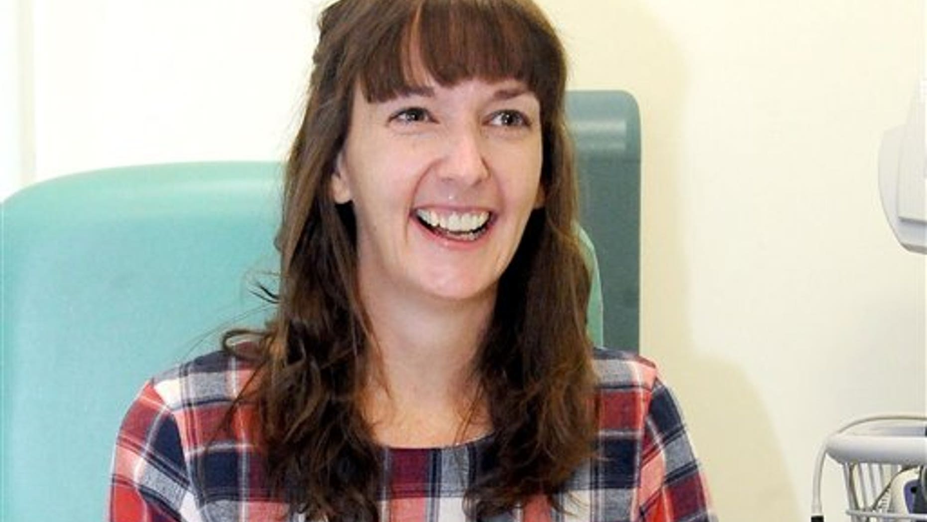 In this Saturday, Jan. 1, 2015 file photo, Pauline Cafferkey, a nurse who contracted Ebola while working in Sierra Leone, smiles in the Royal Free Hospital in London. (Lisa Ferguson/Scotland on Sunday/PA via AP)