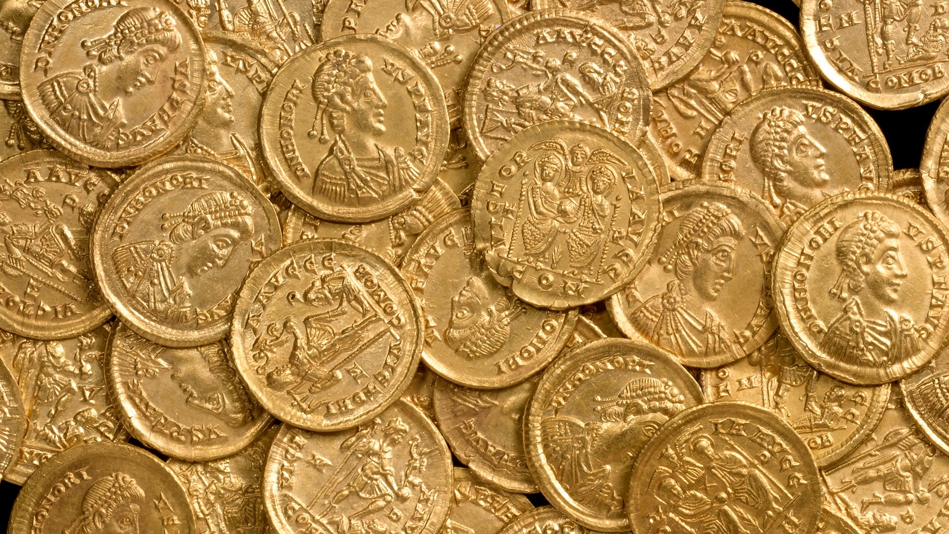 Oct. 17, 2012: In this undated photo released by St Albans City and District Council, late Roman gold coins, examples of the solidus, a high-value coin struck in the late fourth century, are photographed before going on display at the Verulamium Museum, St Albans, England. A curator at the museum says the coins, found on private land north of St. Albans, would have been used for major transactions such as buying land or ship cargoes.