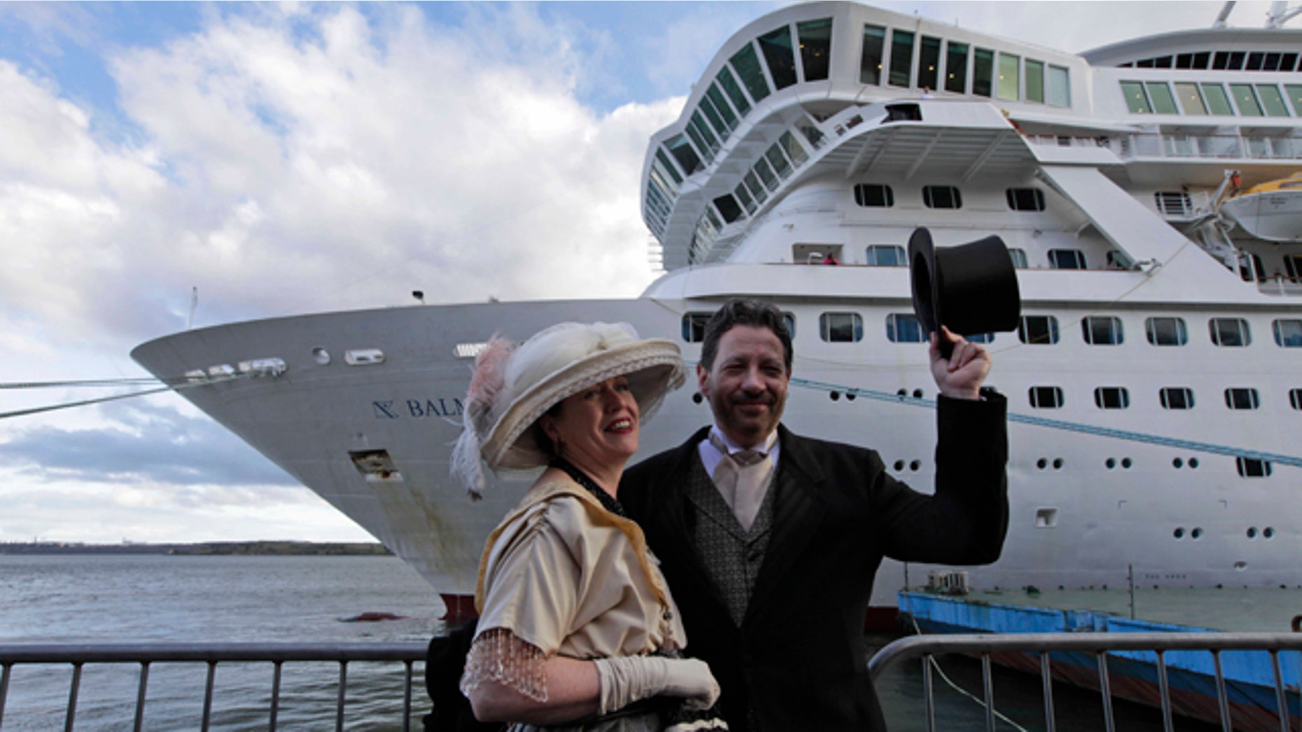 April 9, 2012: Mary Beth Crocker, left, and her husband Tom Dearing from Newport Ky. pose for pictures in period costume as they disembark the MS Balmoral Titanic memorial cruise ship at its first stop in Cobh, Ireland.