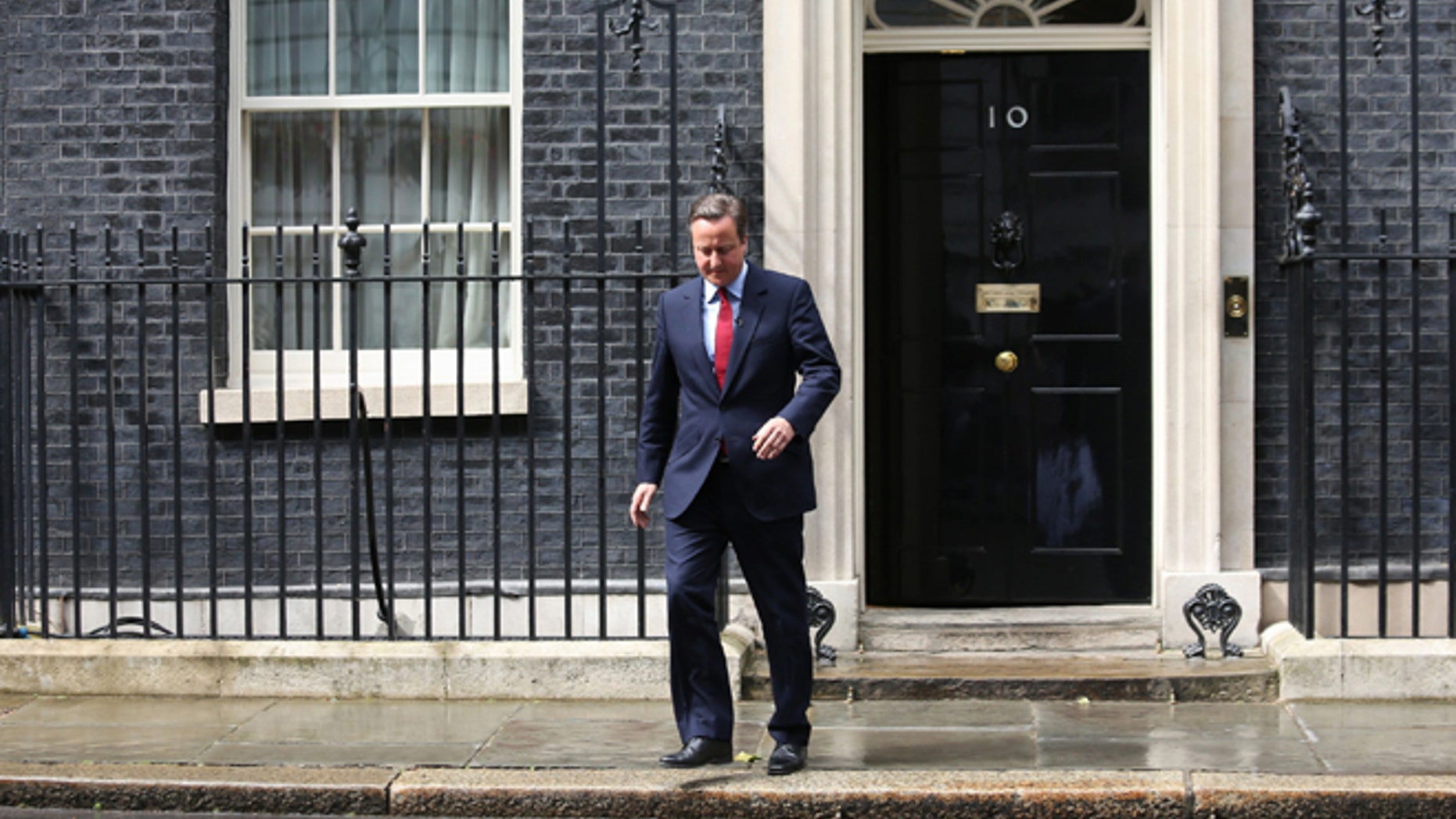 July 11: Britain’s PM David Cameron walks outside No. 10 Downing Street.