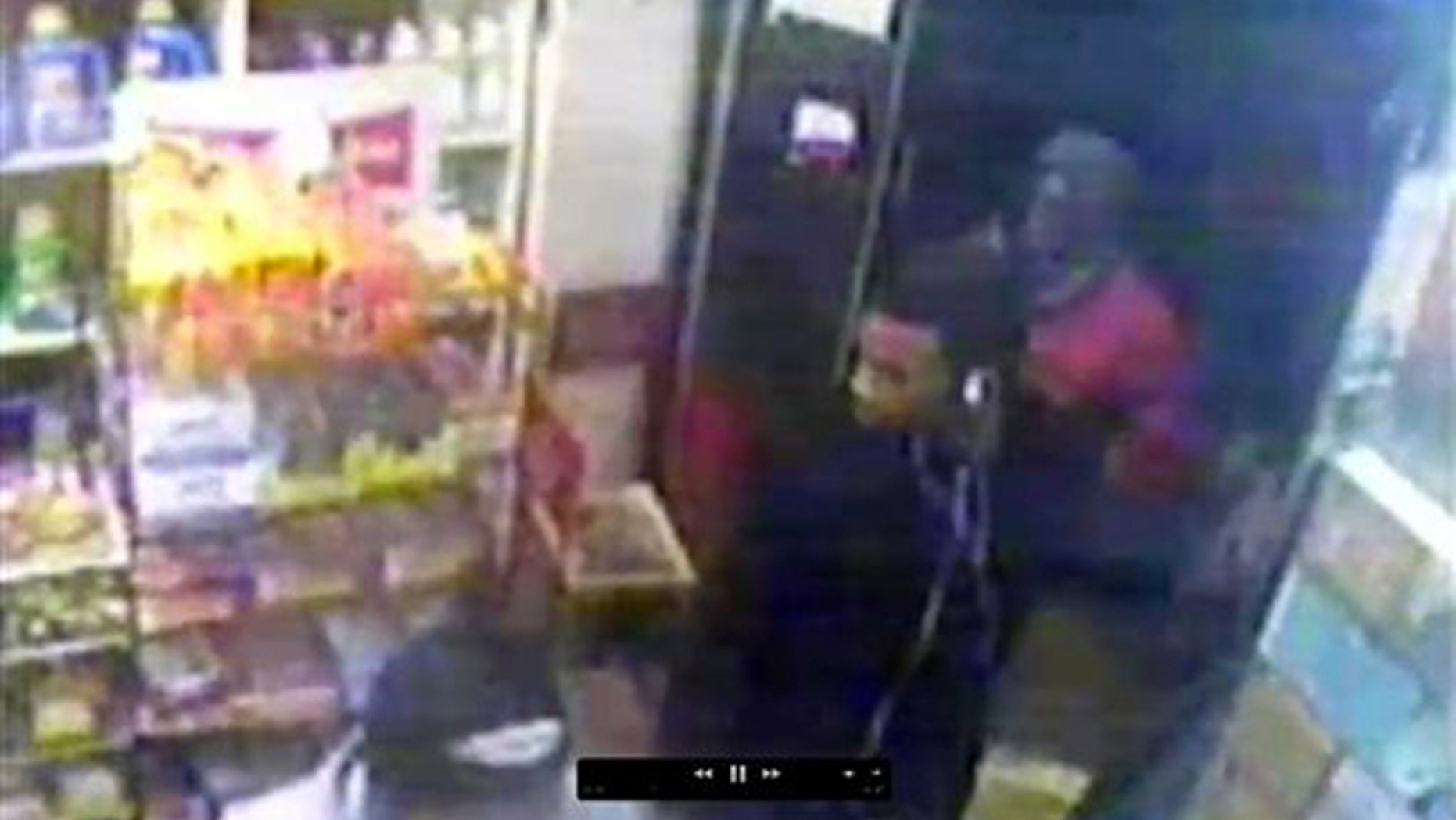This image from security video provided by the New York Police Department, from a security camera at a bodega at 635 Watkins St. in the Brooklyn borough of New York, shows three men who are wanted by police in connection with the gang rape of an 18-year-old woman who was walking in the nearby Osborn Playground with her father later the same evening.