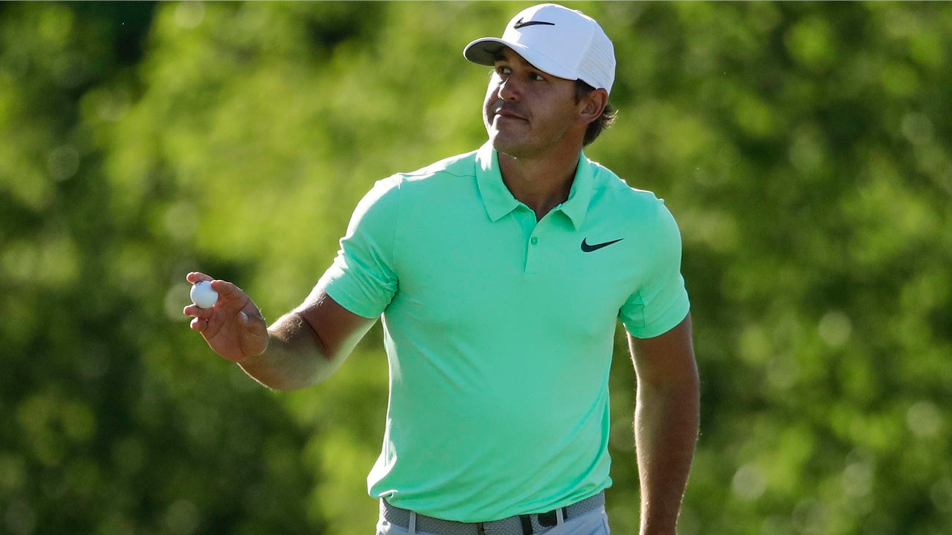 Brooks Koepka reacts after his birdie on the 15th hole during the fourth round of the U.S. Open golf tournament Sunday, June 18, 2017, at Erin Hills in Erin, Wis. (AP Photo/Charlie Riedel)