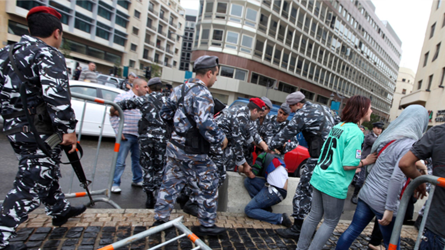 April 28: Lebanese police arrest a man as protesters tried to block a road during a sit-in against the sectarian makeup of Lebanon's government in Beirut, Lebanon. (AP)