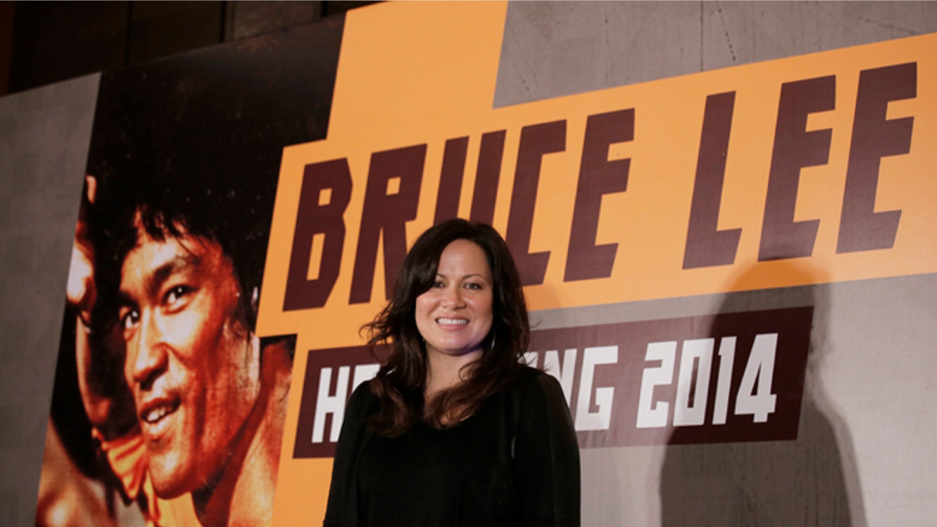 Nov. 24, 2014. Shannon Lee, daughter of Bruce Lee and president of the Bruce Lee Foundation, poses for photographers during a press conference launching instant drinks in her father's name in Hong Kong.