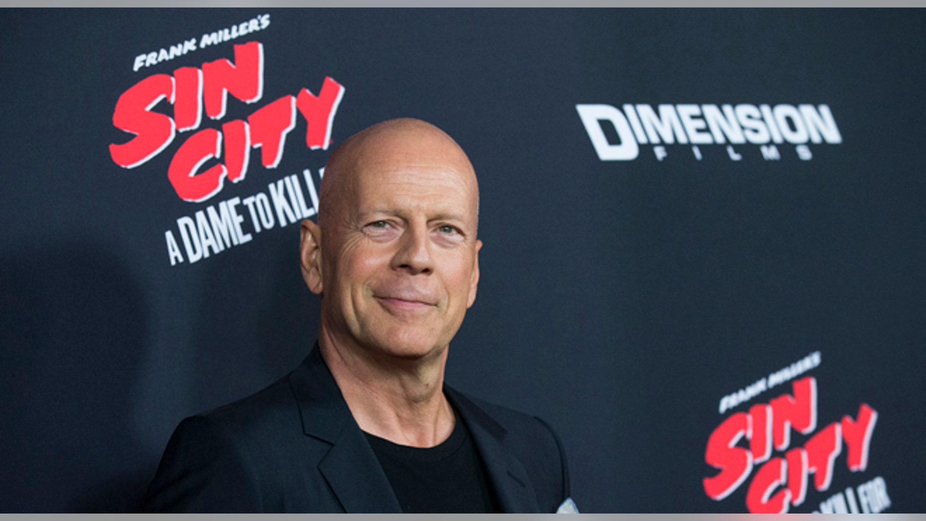 August 19, 2014. Bruce Willis poses at the premiere of "Sin City: A Dame to Kill For" in Hollywood, California.