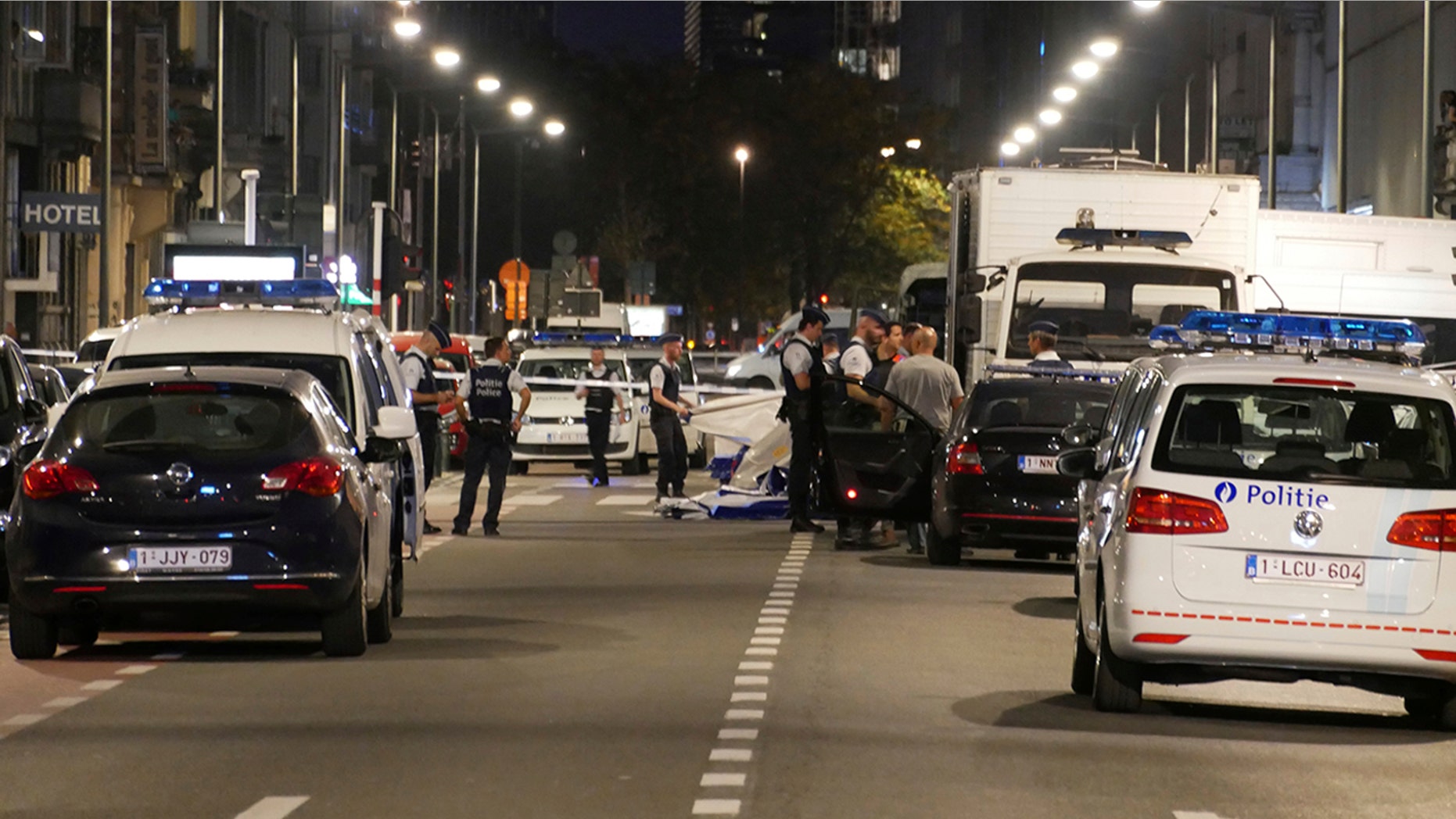 Police secure the scene in downtown Brussels after an attack on Belgian Army soldiers Friday night.