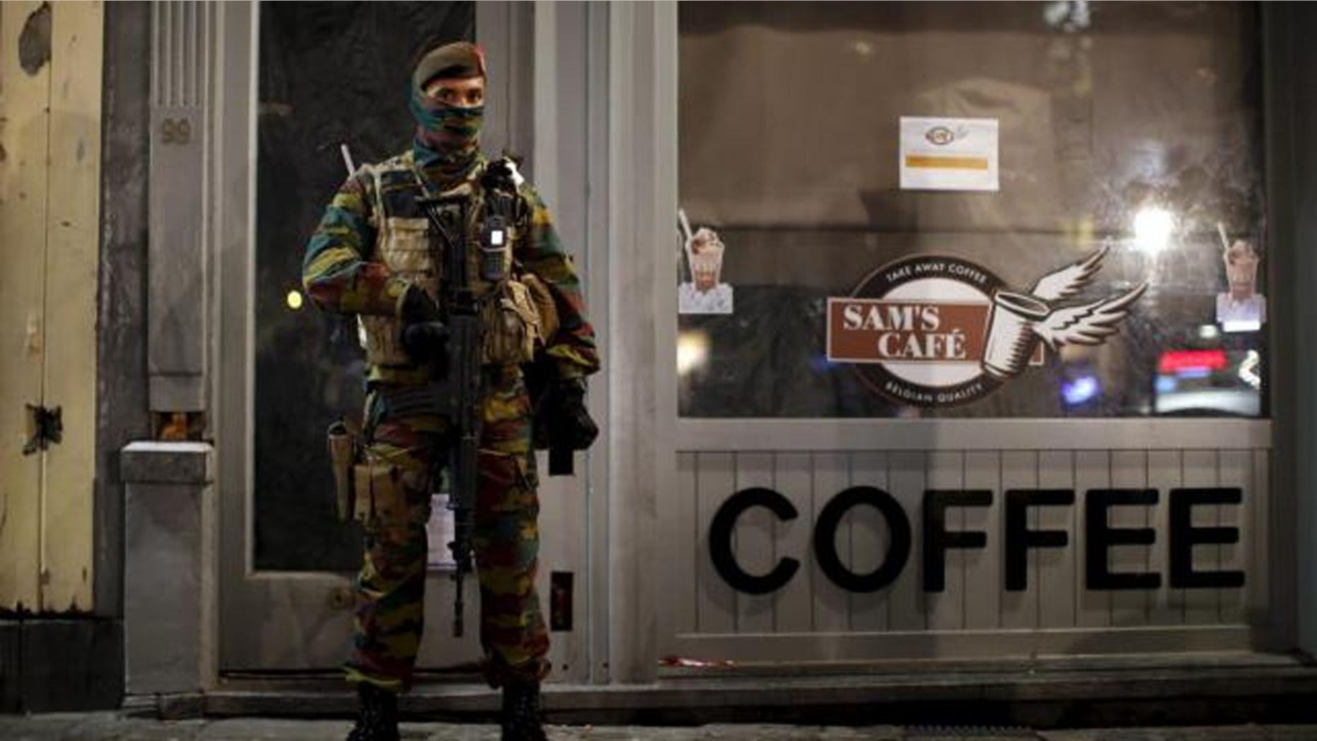 Belgian soldiers patrol in central Brussels as the city is on lockdown.