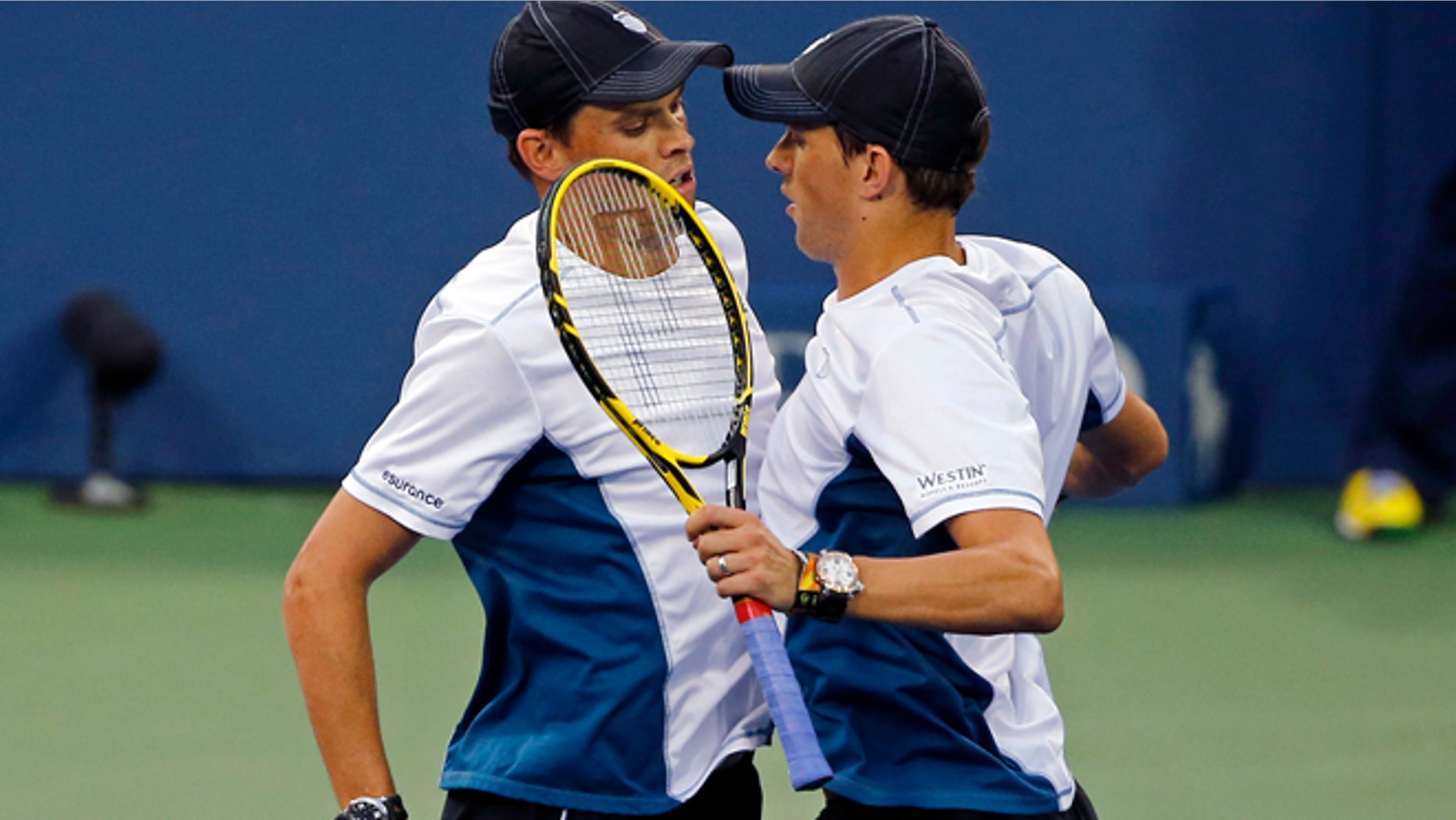Aug. 30, 2014: Doubles partners Bob Bryan, left, and Mike Bryan of the United States chest-bump to celebrate their victory against Jared Donaldson and Michael Russell, of the United States, during the U.S. Open tennis tournament in New York. (AP)
