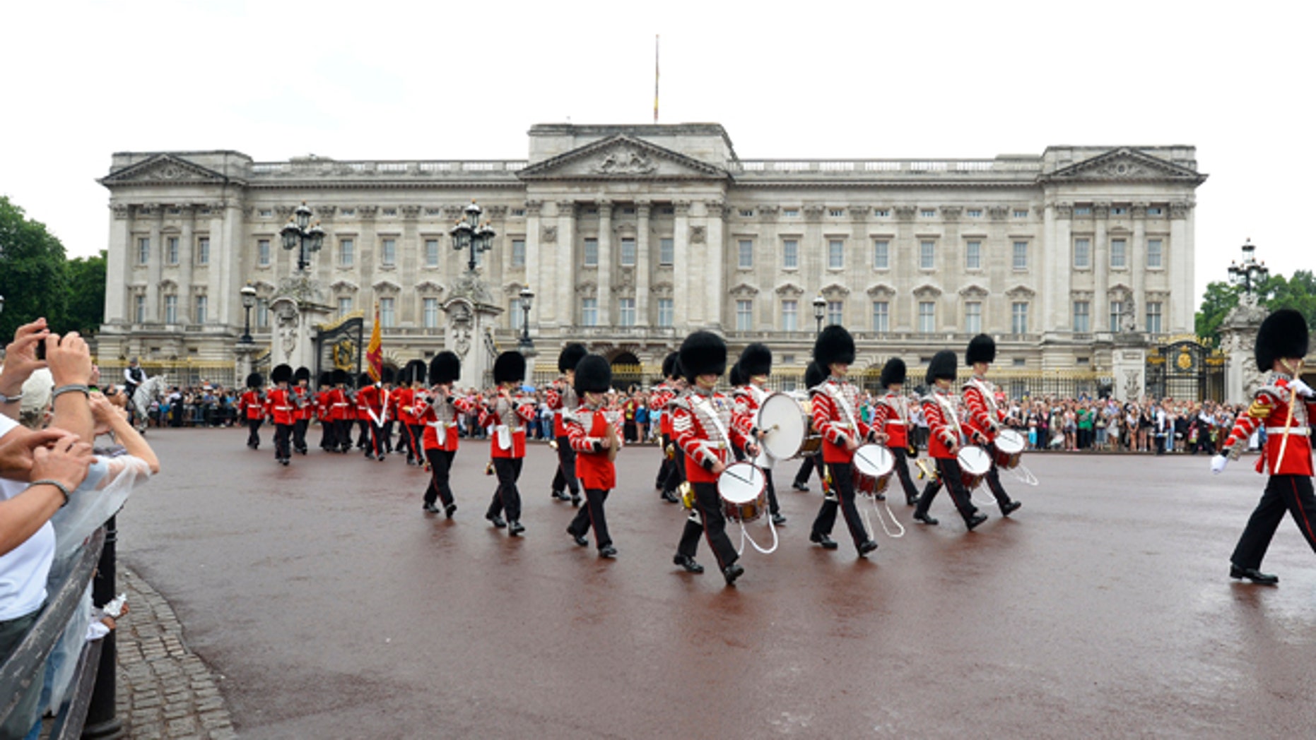 July 23: Guardsmen perform the Changing the Guard ceremony in front of Buckingham Palace, in central London.