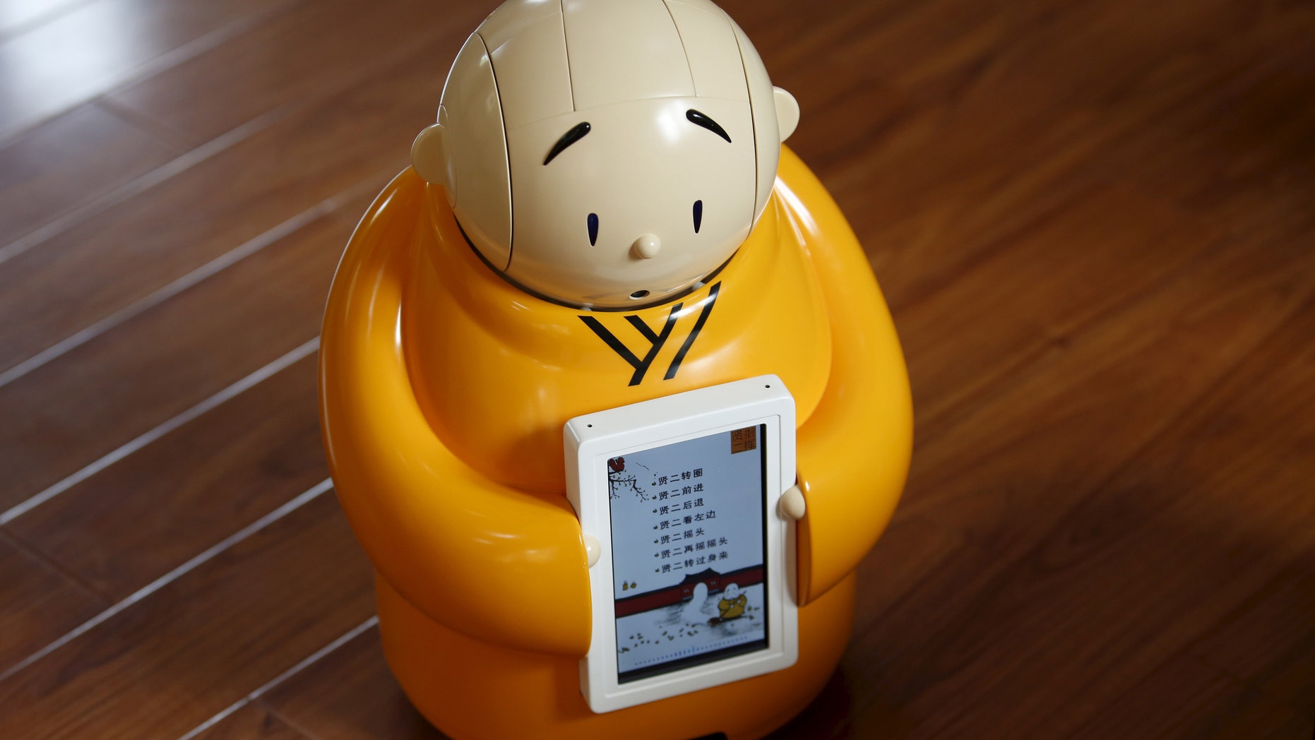 Robot monk Xian'er is pictured during its demonstration for a photo opportunity at Longquan Buddhist temple on the outskirts of Beijing, April 20, 2016. (REUTERS/Kim Kyung-Hoon)