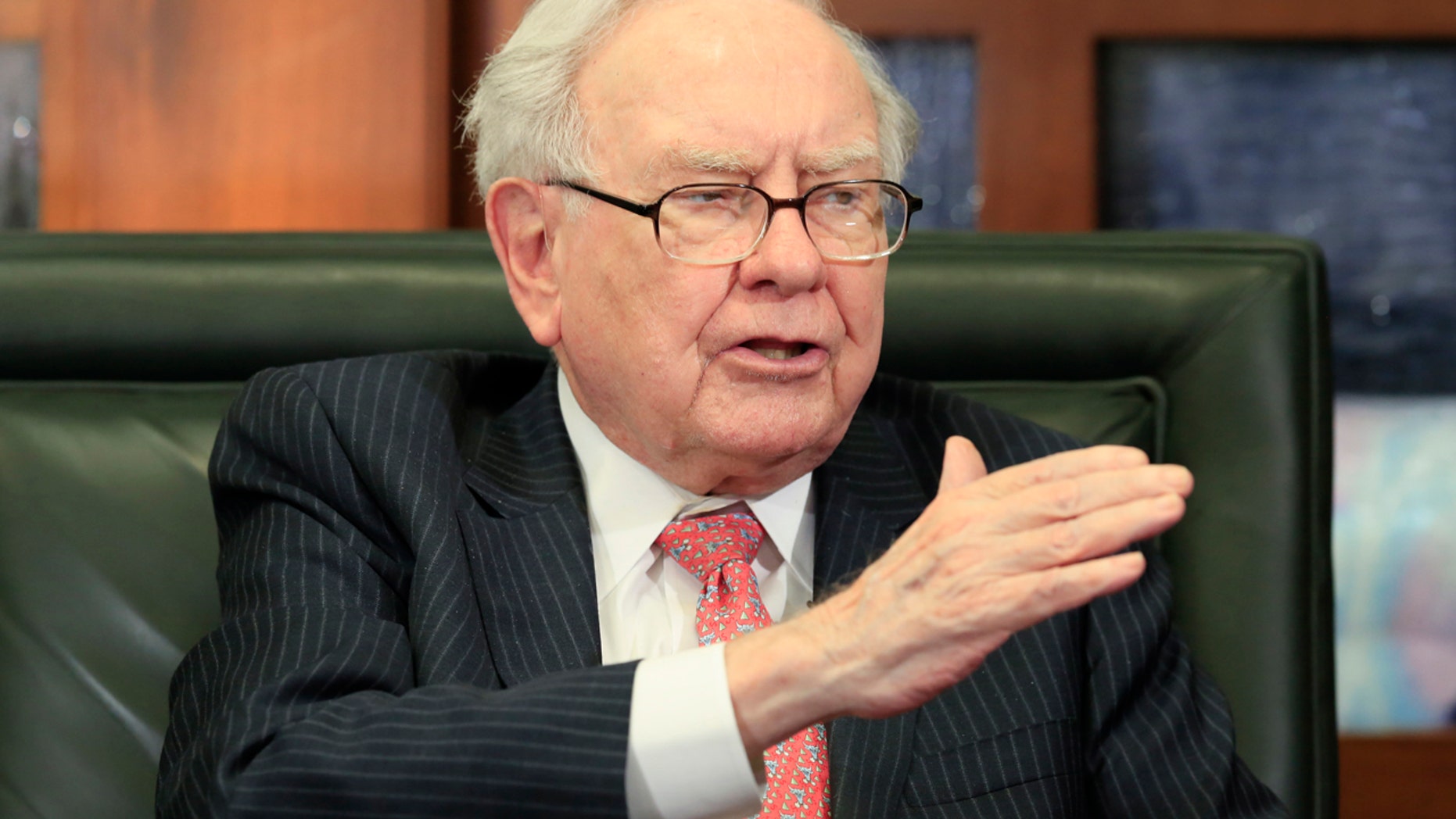 In a Monday, May 8, 2017 file photo, Berkshire Hathaway Chairman and CEO Warren Buffett gestures during an interview by Liz Claman of the Fox Business Network in Omaha, Neb.