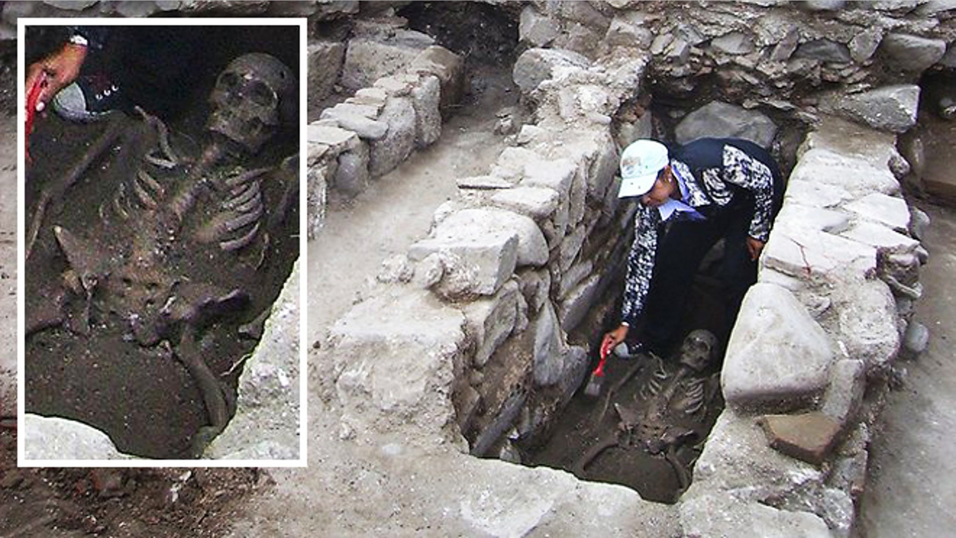 Restless dead: An archaeologist cleans a skeleton during excavations in Bulgaria, where the remains of two bodies were found pierced with iron rods to keep them from turning into vampires.