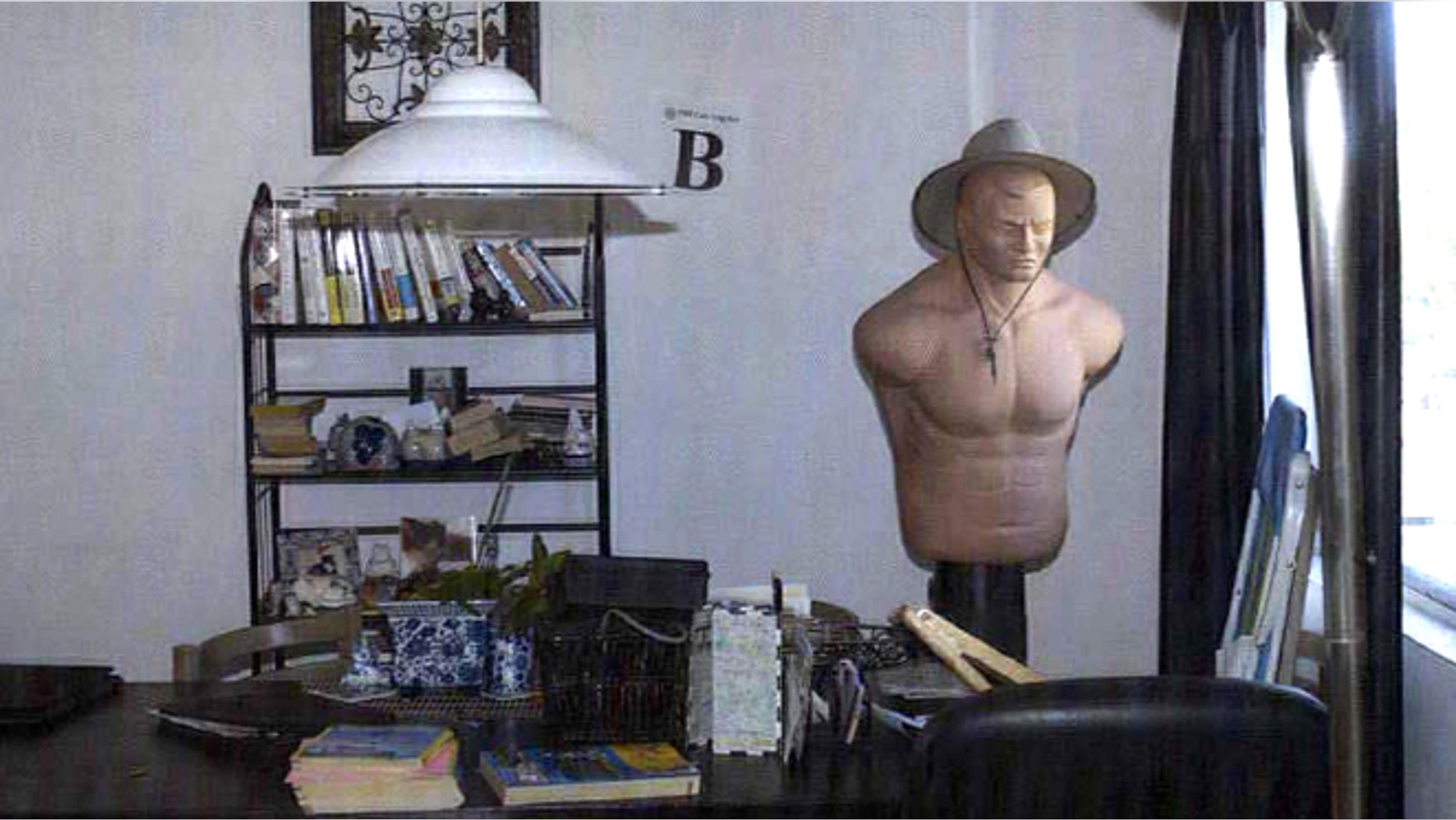 This photo provided by the U.S. Attorney's office shows inside James 'Whitey' Bulger and Catherine Greig's apartment at the Princess Eugenia complex, in Santa Monica, Calif. Authorities are planning to auction any 'items of value' found in the California apartment where Bulger and his girlfriend hid out for years, a way to come up with at least some measure of compensation for the families of his victims. (AP/US Attorney's Office, File)