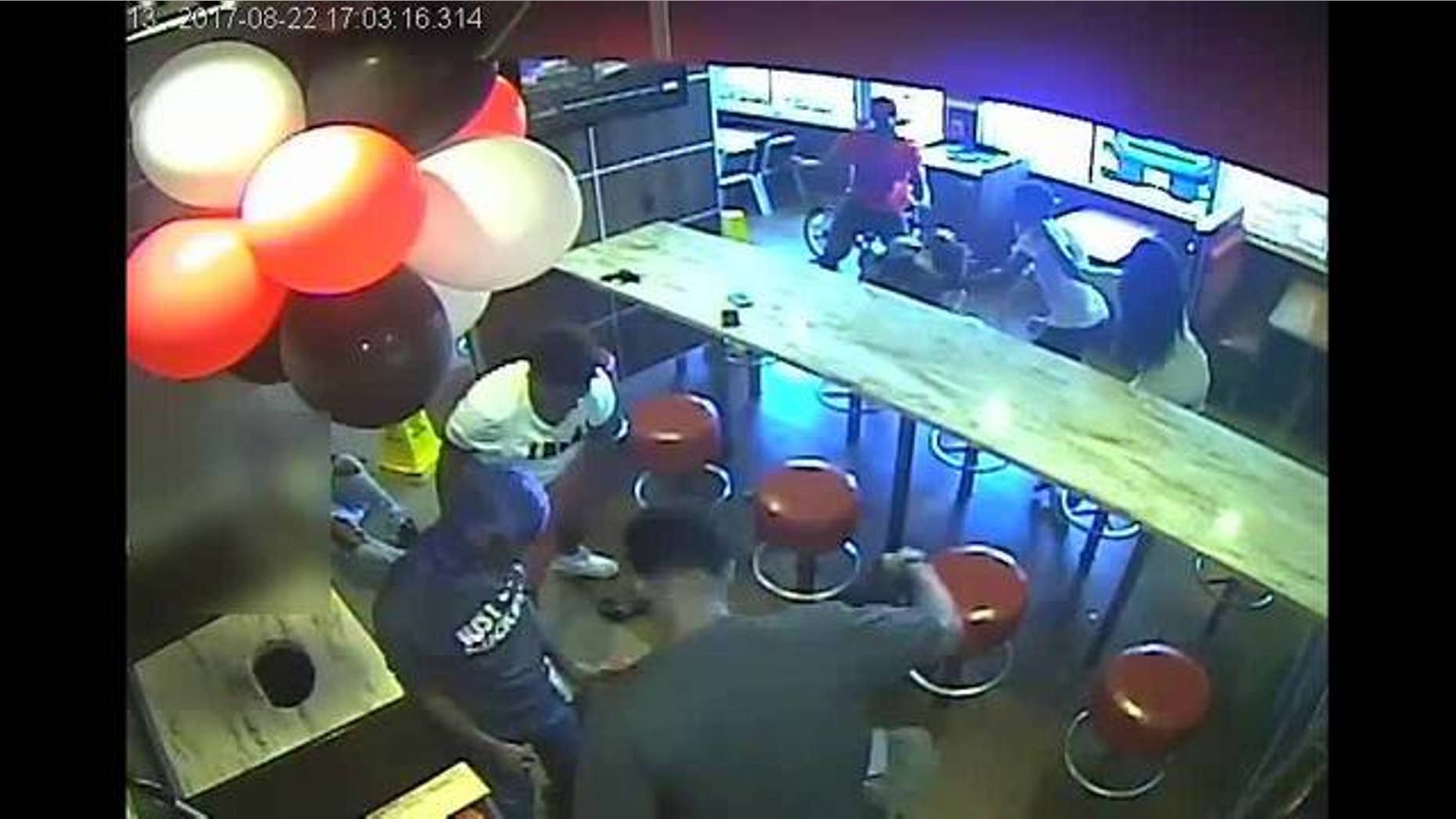 Surveillance video captured an attack at a Burger King restaurant in Long Island, N.Y., on August 22.