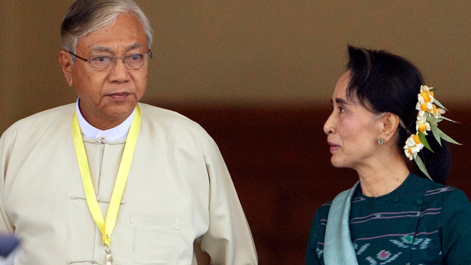 March 15, 2016: Htin Kyaw, left, newly elected president of Burma, walks with National League for Democracy leader Aung San Suu Kyi, right, at Burma's parliament in Naypyitaw, Burma.