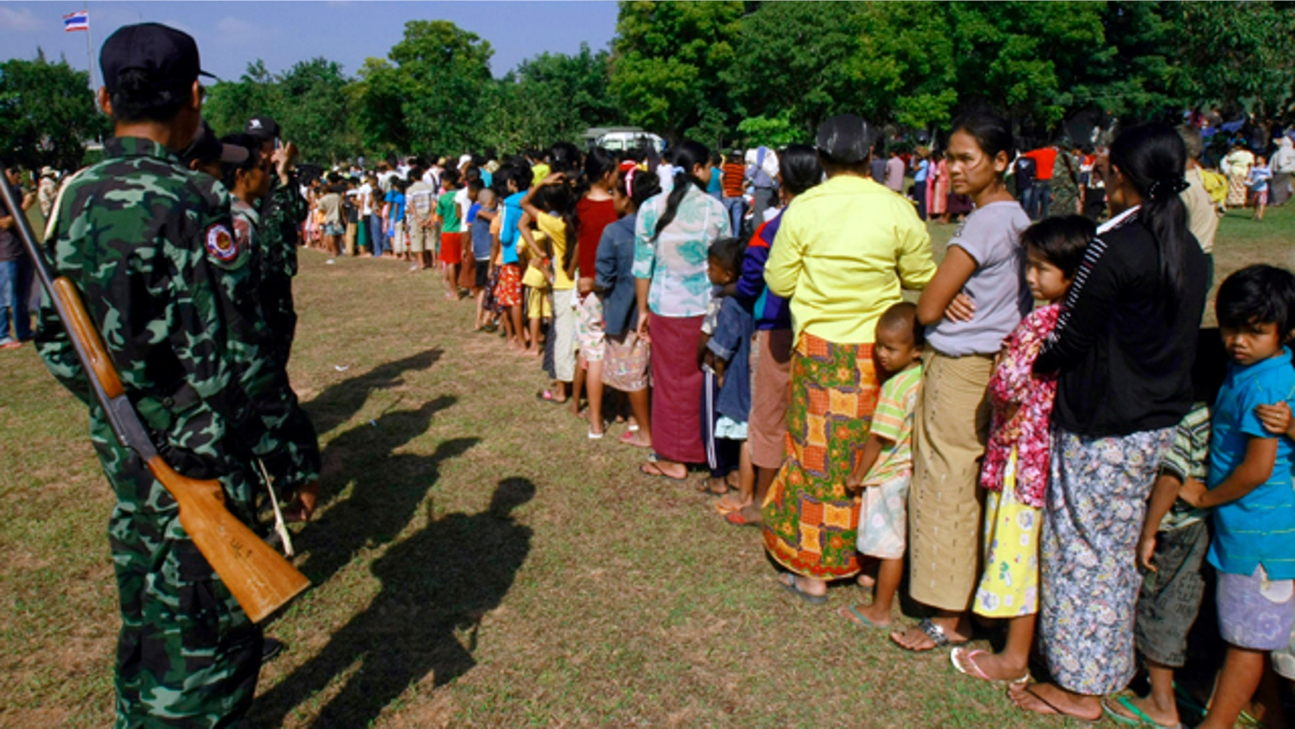 Nov. 8: Myanmar citizens queue up for food at the Border Patrol Police base in Thailand's Mae Sot town following fighting between Myanmar soldiers and ethnic Karen fighters. Clashes between rebels and Myanmar government troops have broken out at two key border points a day after the country's first election in two decades. The fighting prompted thousands of refugees to flee into neighboring Thailand. (AP)