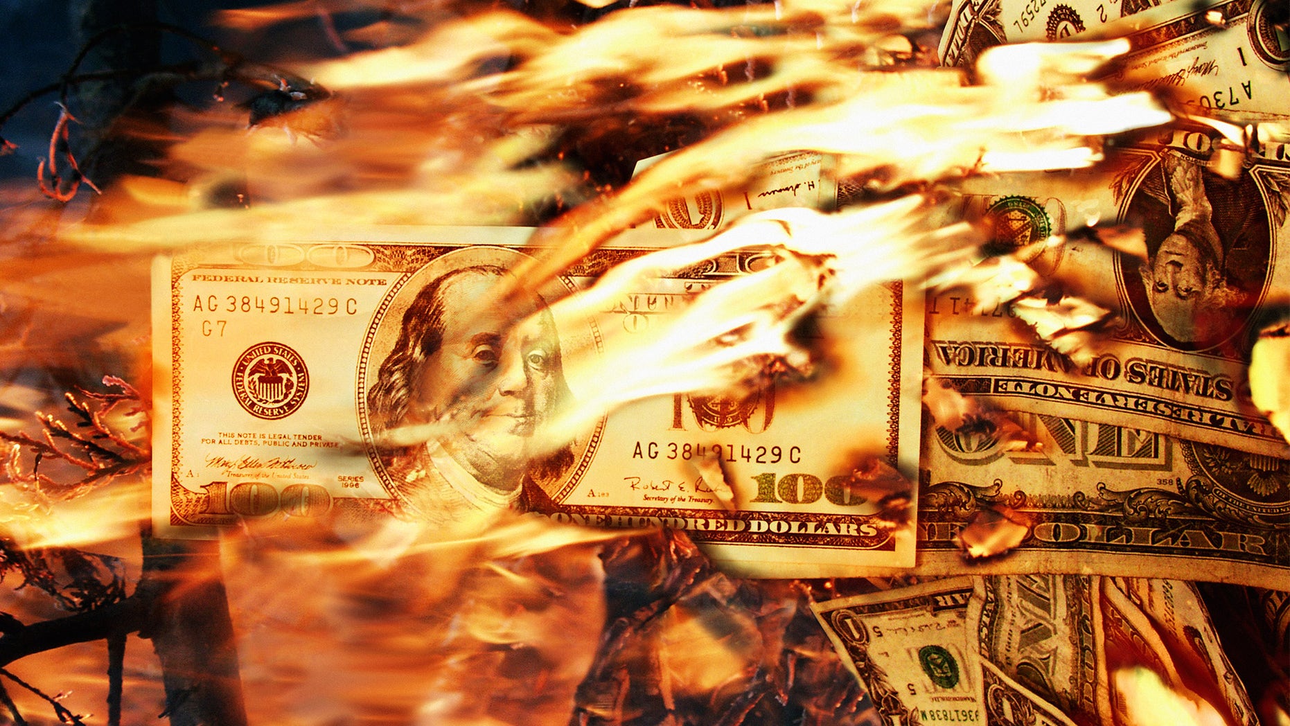 One Hundred Dollar Bills in fire