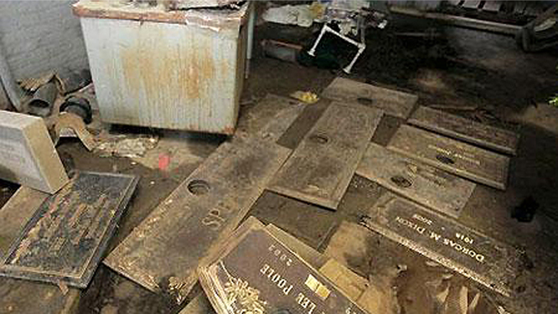 July 10, 2009: Grave markers are seen scattered on the floor of a shack at the Burr Oak Cemetery in Alsip, Ill., where four workers allegedly dug up at least 300 graves and dumped the bodies into unmarked mass graves to resell the plots for a profit. A $7.6 million settlement was later reached, but death care adovcates say problems plaguing the industry aren't limited to 150-acre cemetery.