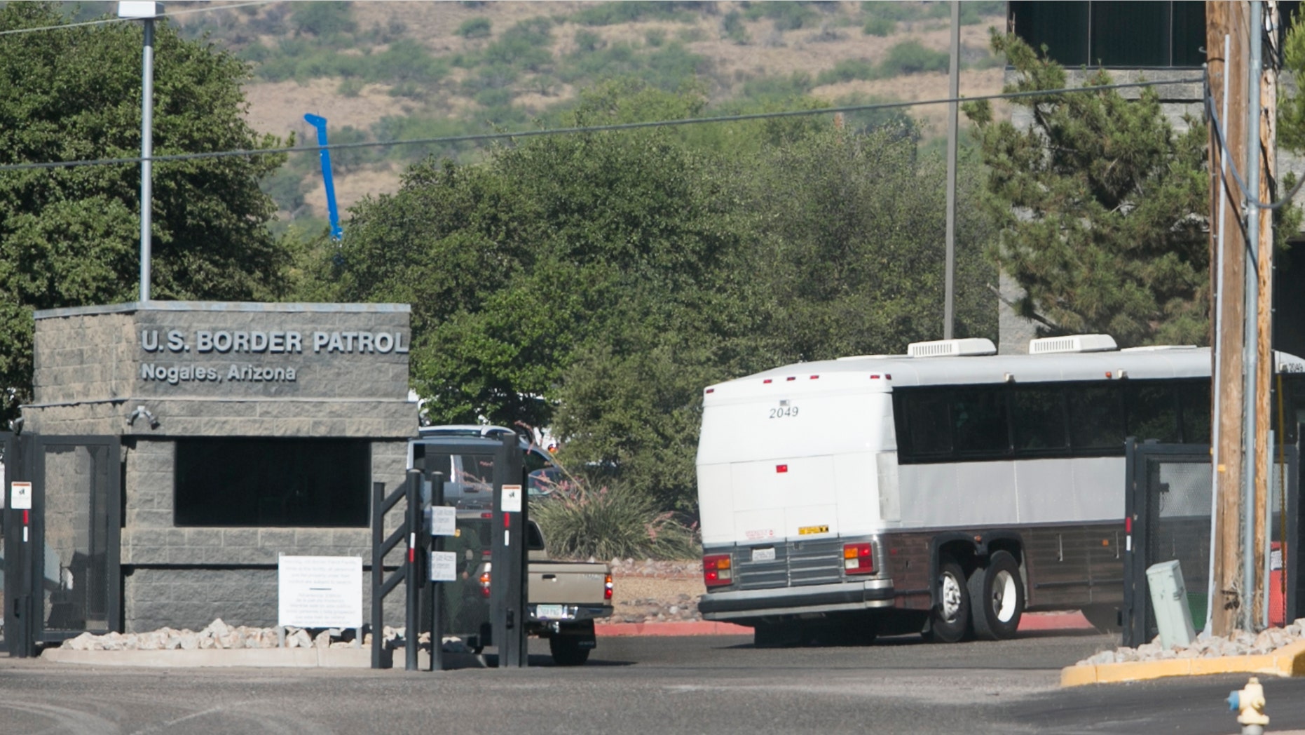 A bus carrying children arrives to a border patrol facility in Nogales, Ariz., Saturday, June 7, 2014.
