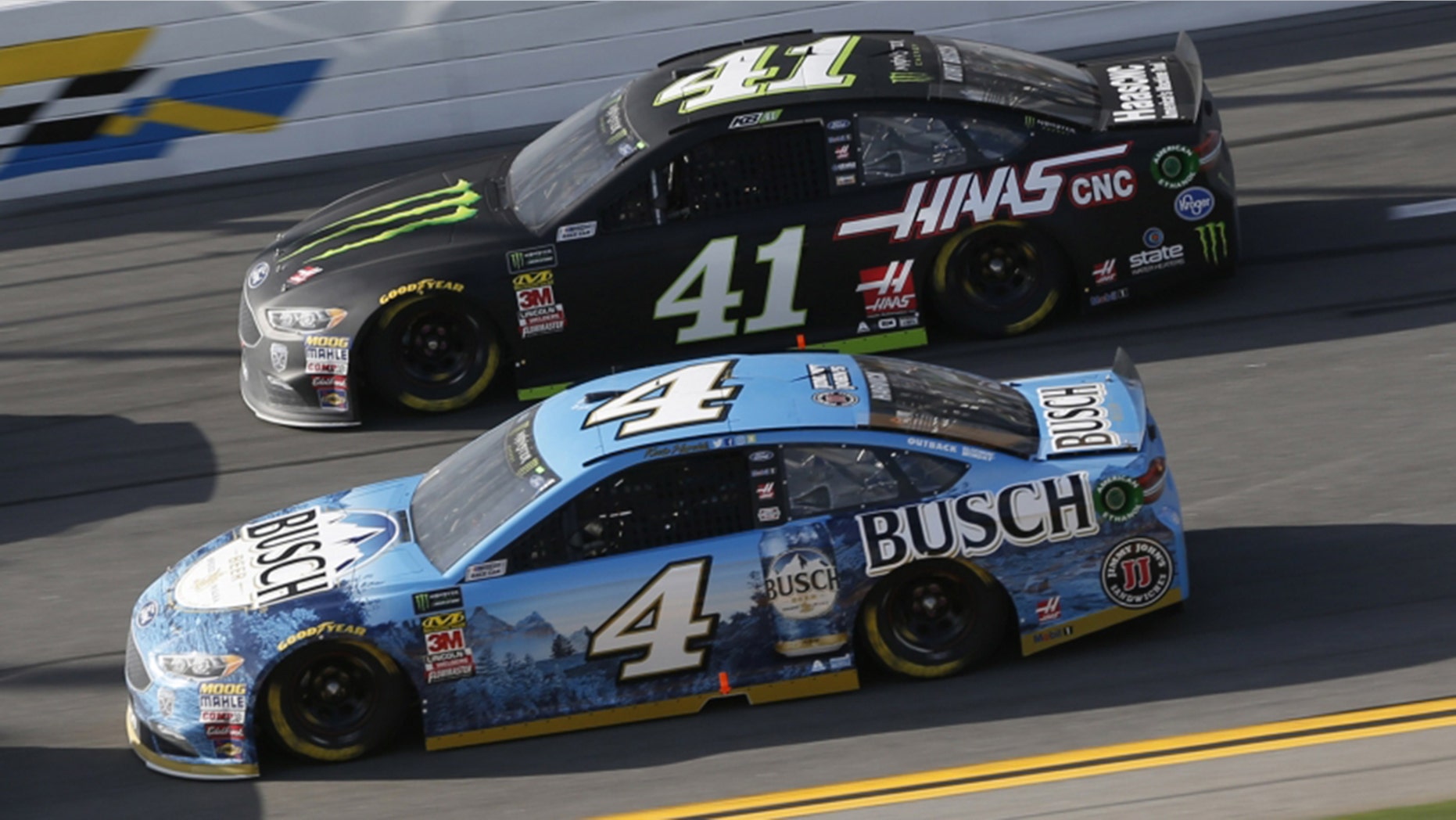 Kevin Harvick (4) battles Stewart-Haas teammate Kurt Busch in the Advance Auto Parts Clash