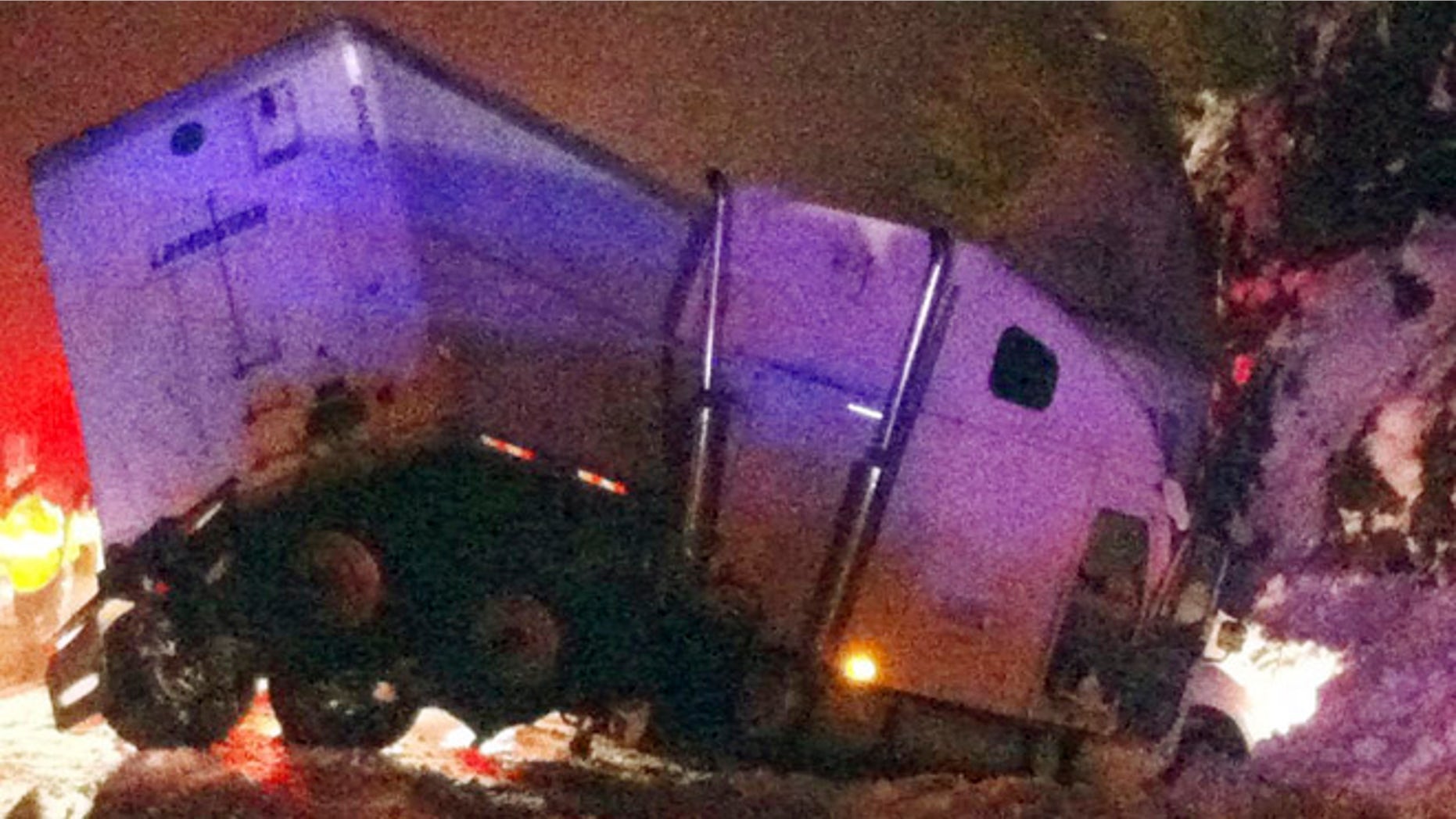 Feb. 21, 2014: In this photo, a tractor trailer rig sits jackknifed after colliding with a tour bus on Route 22A in West Haven, Vt.