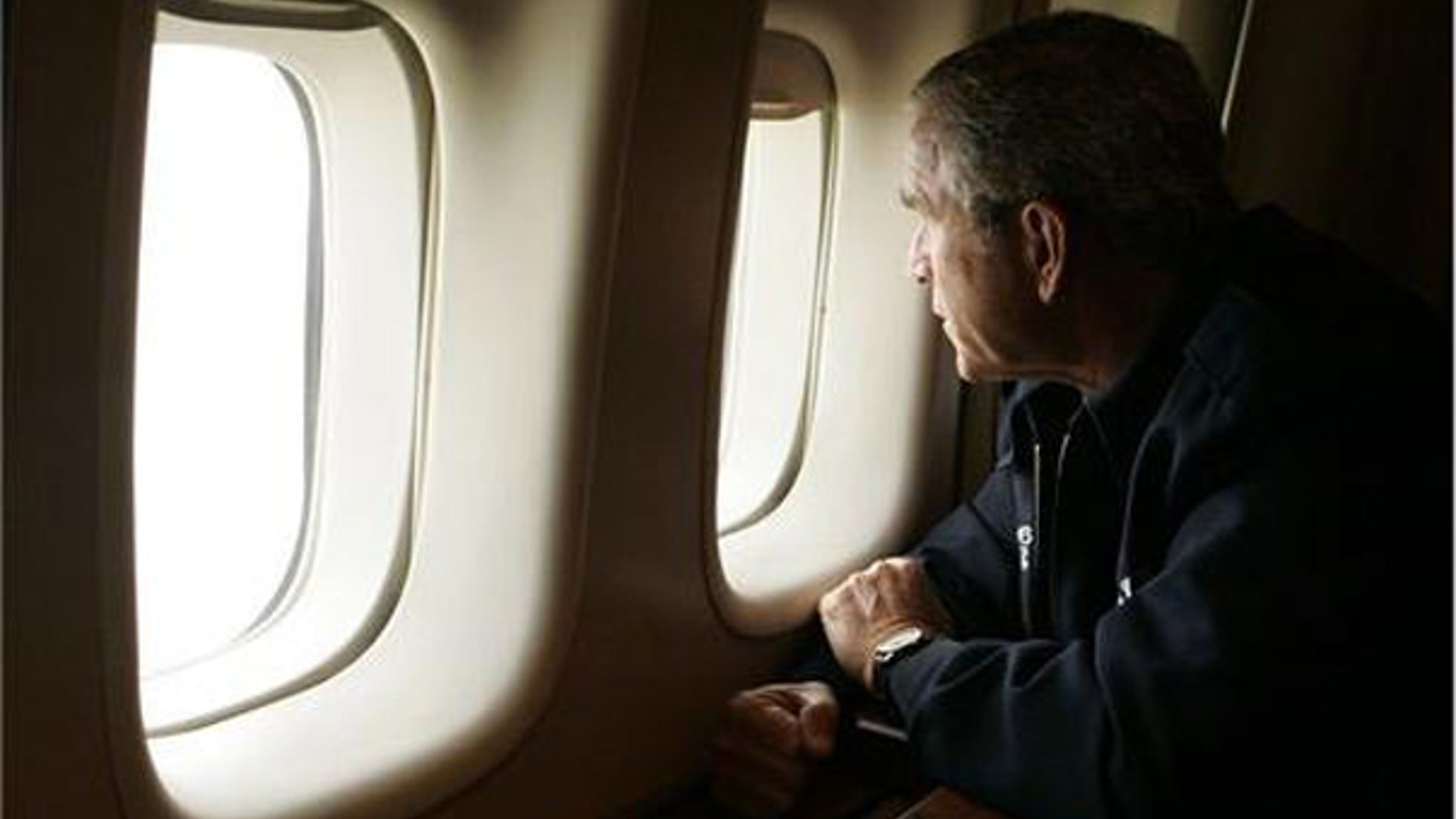 President Bush looks out the window of Air Force One inspecting damage from Hurricane Katrina while flying over New Orleans en route back to the White House. (AP)