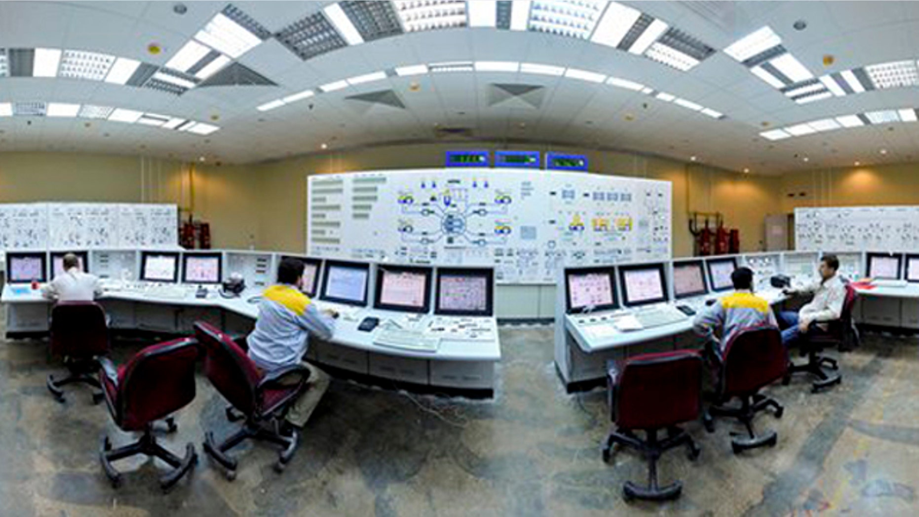 In this Nov. 30, 2009, file photo released by the semi-official Iranian Students News Agency (ISNA), workers are shown at the Bushehr Nuclear Power Plant in Iran. (AP Photo)