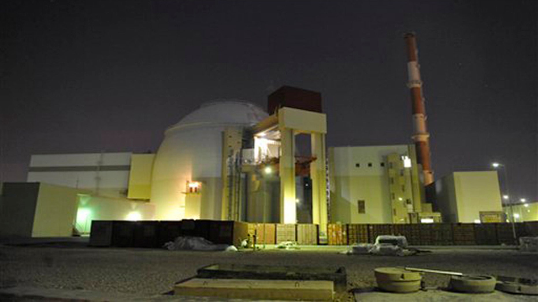 The reactor building of Iran's Bushehr Nuclear Power Plant is silhouetted in this November 2009 photo released by the semi-official Iranian Students News Agency (ISNA).