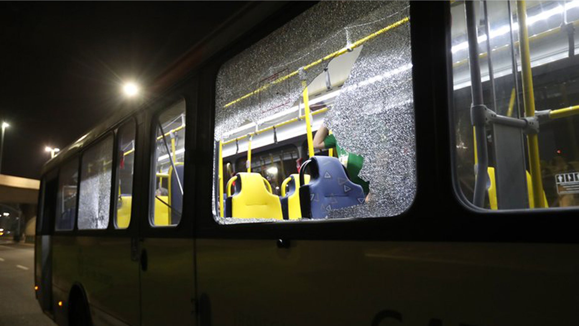 Aug. 9, 2016: This image shows shattered windows on a Olympic media bus that was shot at on a highway in Rio de Janeiro, Brazil