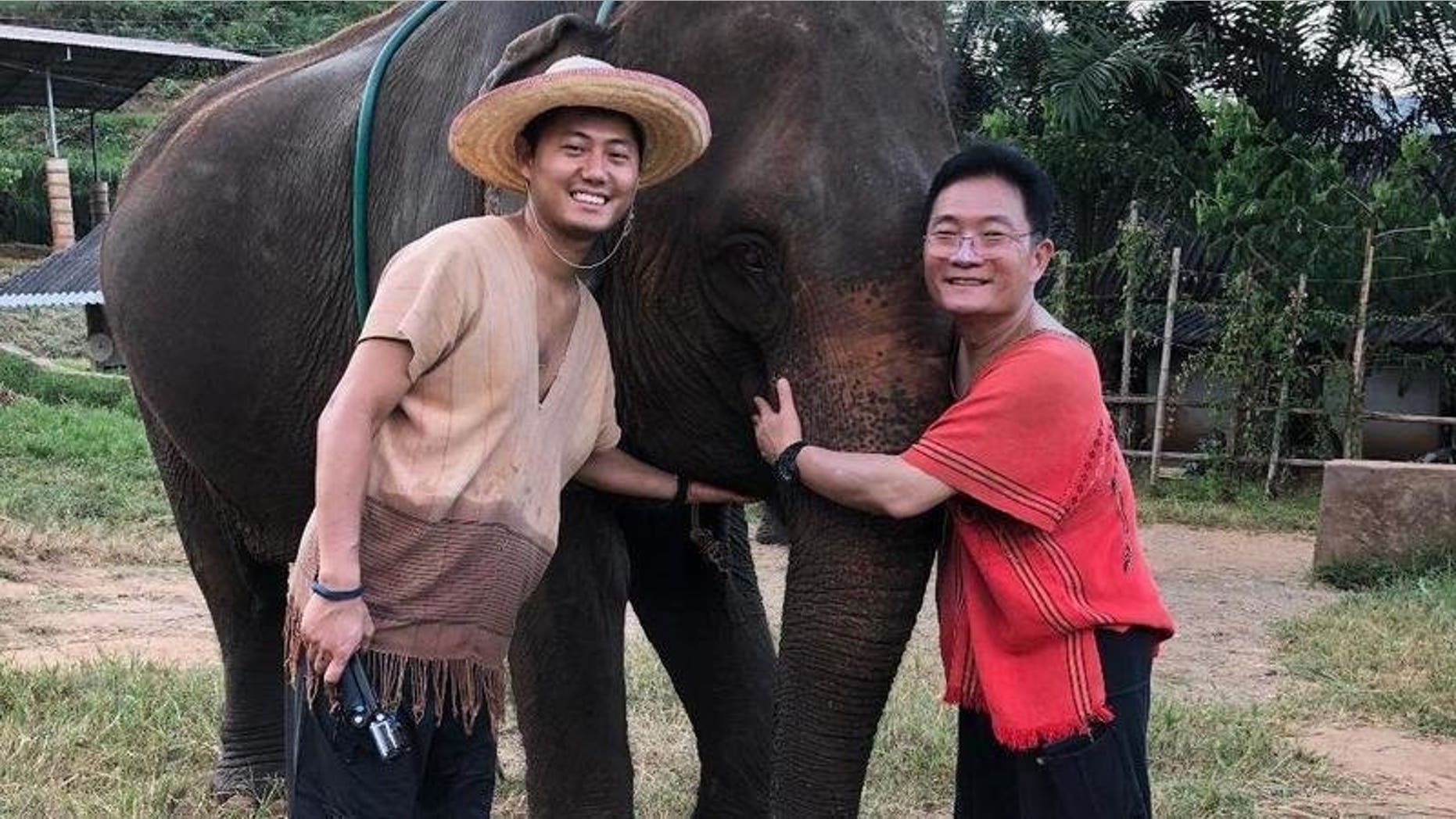 Jonathan Lee, left, says his father Joseph, right, has been imprisoned in the United Arab Emirates upon their return home from a trip to Thailand.