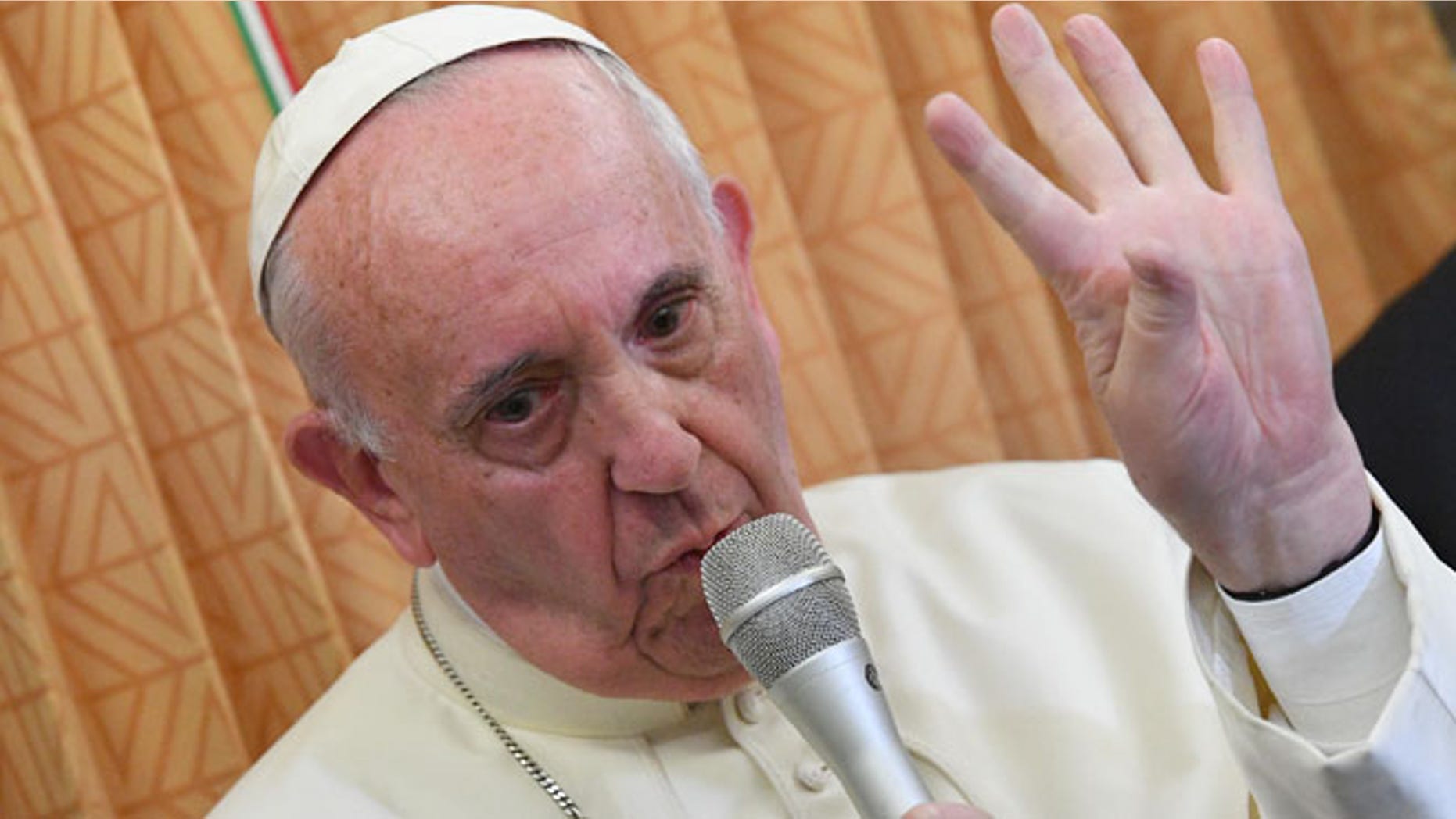 Pope Francis speaks with journalists on board the flight from Baku to Rome, Sunday, Oct. 2, 2016.