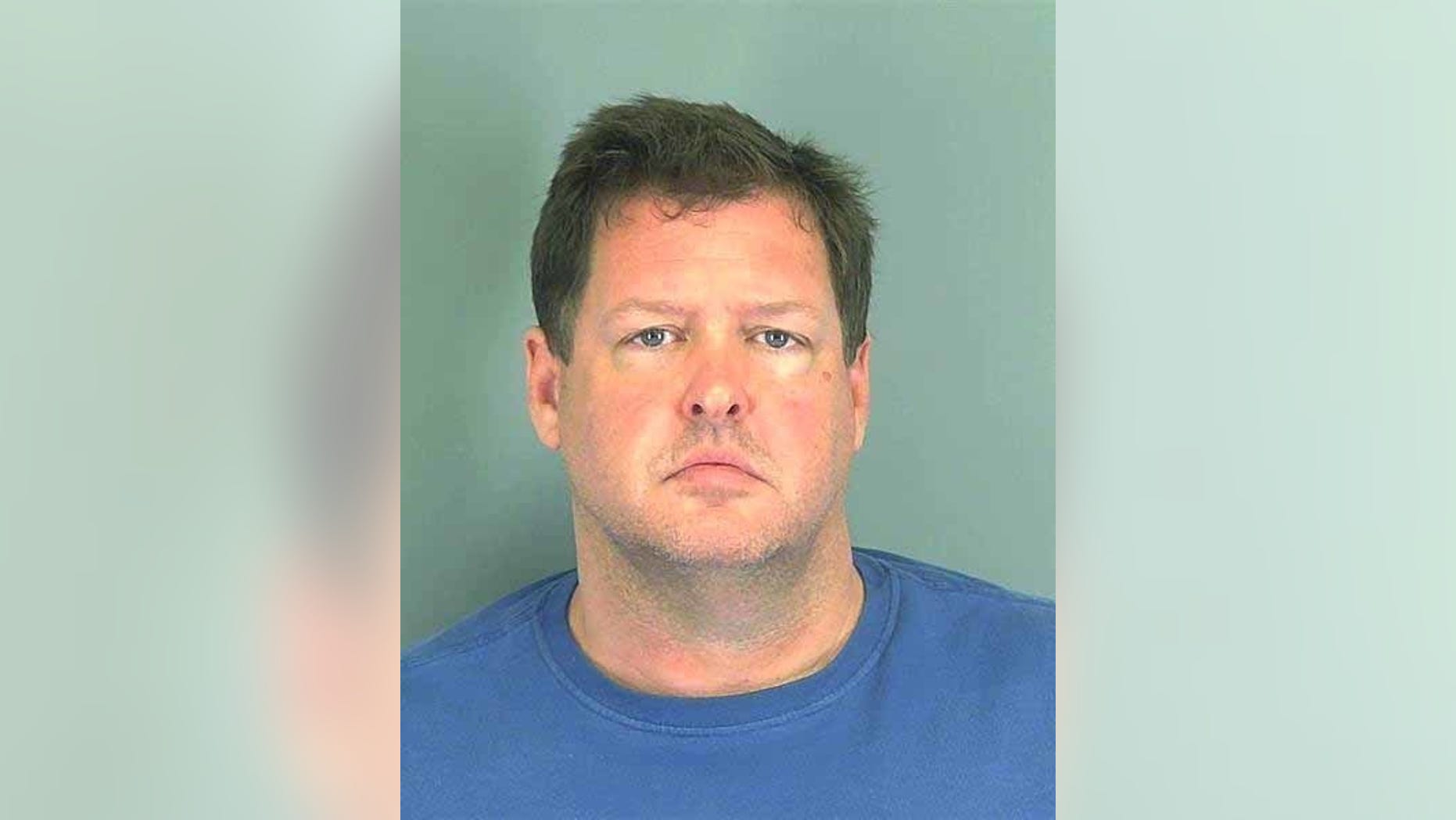 FILE - This photo made available by the Spartanburg, S.C., County Sheriff's Office shows Todd Kohlhepp of Moore, S.C. A woman who police say was locked in a storage container for two months by Kohlhepp, who is charged with killing seven people, is suing her alleged captor. The woman sued Wednesday, Nov. 30, 2016, in Spartanburg County, where authorities say Kohlhepp kidnapped her on Aug. 31 after talking to her and her boyfriend about hiring them to clean up his property (Spartanburg County Sheriff's Office via AP, File)