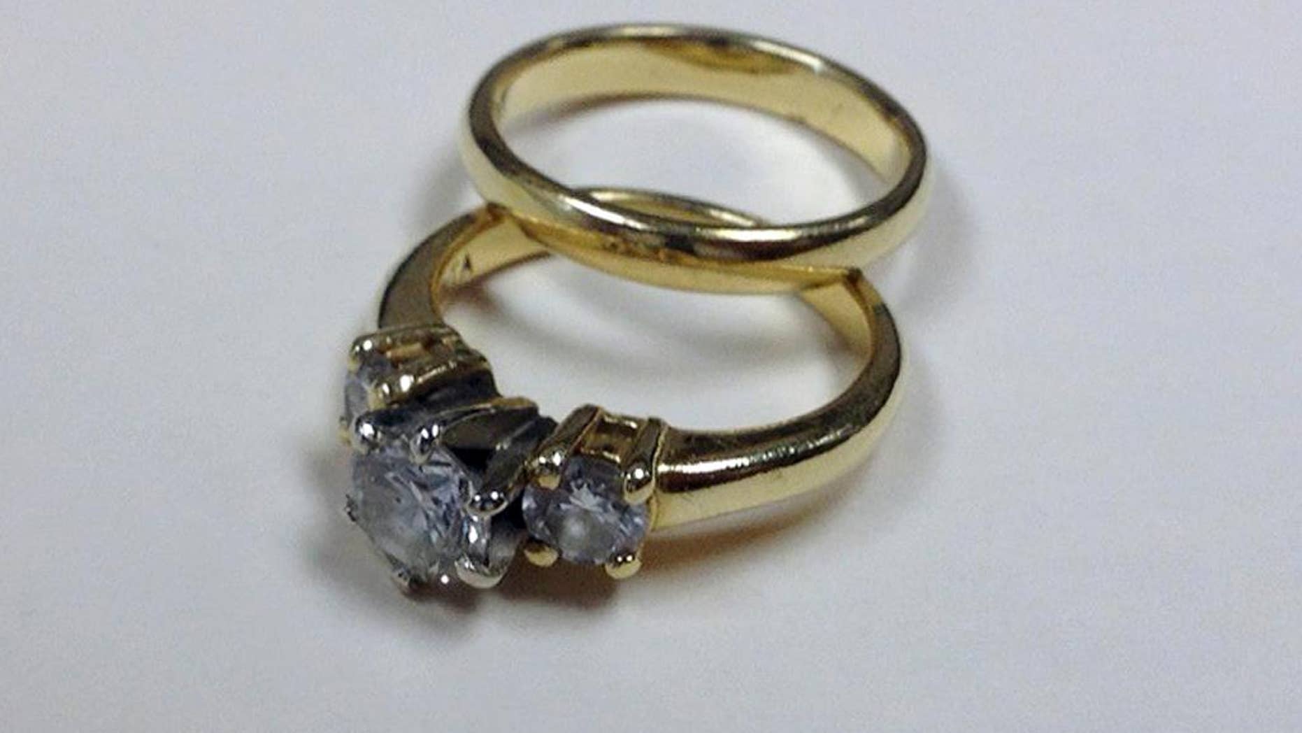 FILE - This Thursday, Dec. 4, 2014 file photo made in Cambridge, Mass. and provided by The Salvation Army shows a diamond ring, valued at $1,850, and a wedding band, that were placed in a red donation kettle outside Boston's North Station. The Salvation Army said the rings, given by an anonymous widow in honor of her late husband, were accompanied by a note in which the woman said she hoped they would be sold and the money used to buy toys for needy children. Salvation Army Major David Davis said Monday, Dec. 15, 2014 that a former bell ringer has offered $21,000 for the two rings. (AP Photo/The Salvation Army, Salvation Army Lt. Michael Harper, File)