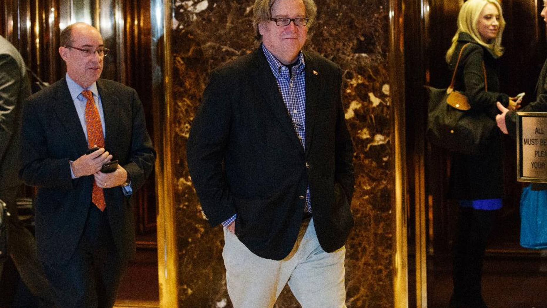 FILE - In this Friday, Nov. 11, 2016, file photo, Stephen Bannon, campaign CEO for President-elect Donald Trump, leaves Trump Tower in New York. Trump on Sunday named Republican Party chief Reince Priebus as White House chief of staff and conservative media owner Bannon as his top presidential strategist, two men who represent opposite ends of the unsettled GOP. (AP Photo/Evan Vucci, File)