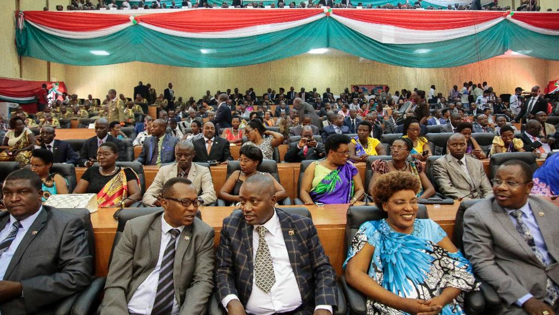 FILE - In this Thursday, Aug. 20, 2015 file photo, members of Burundi's Parliament prepare for the swearing-in ceremony of President Pierre Nkurunziza, in the parliament building in Bujumbura, Burundi. Lawmakers in Burundi overwhelmingly voted Wednesday, Oct. 12, 2016 in support of a plan to withdraw from the International Criminal Court (ICC), escalating a bitter dispute with the international community over the human rights situation in the East African country, although the decision is not immediate. (AP Photo/Gildas Ngingo, File)
