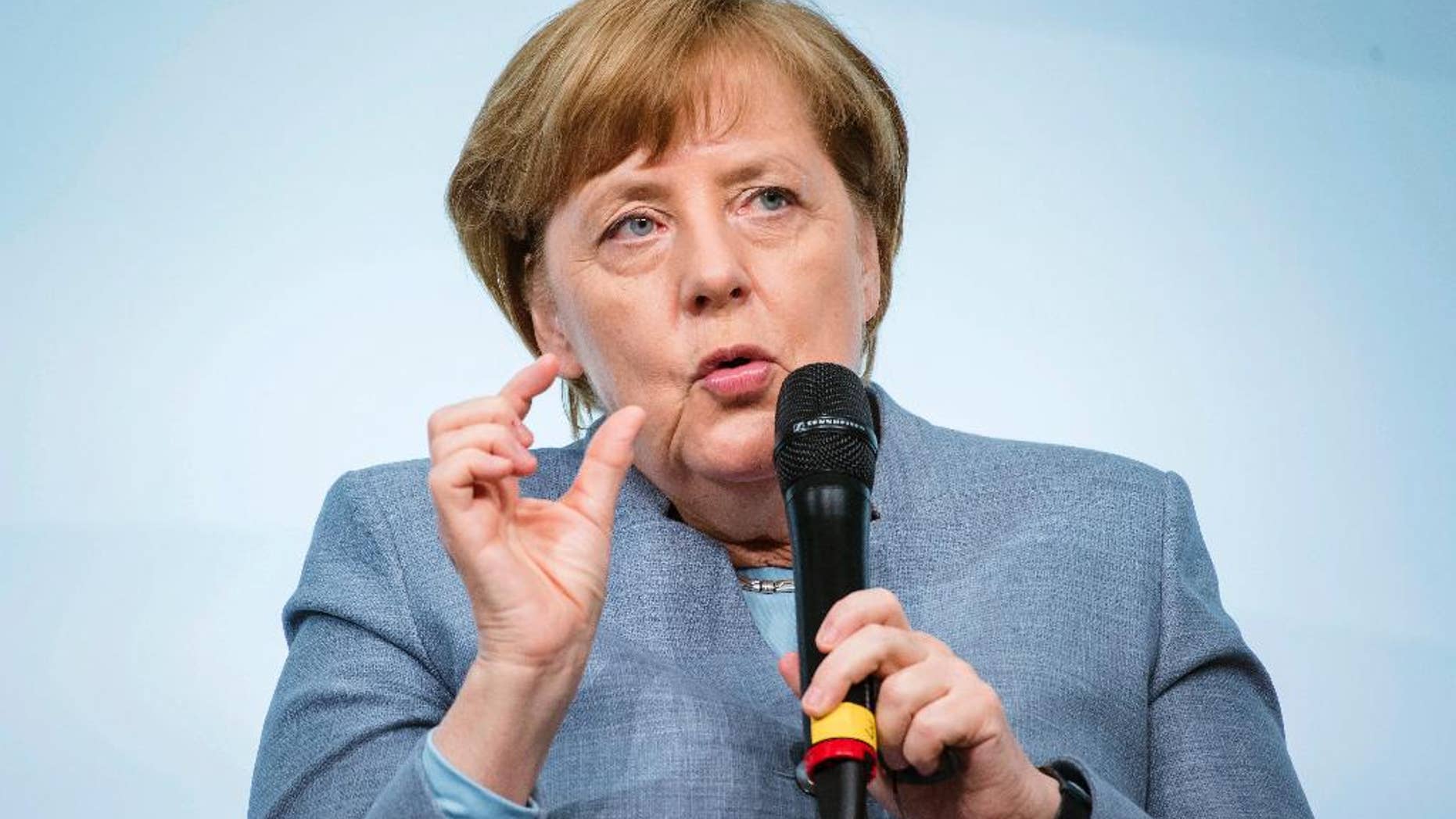 German Chancellor Angela Merkel speaks at the W20 Summit in Berlin, Germany, Wednesday, April 26, 2017. The conference aims at building support for investment in women's economic empowerment programs. (Gregor Fischer/dpa via AP)