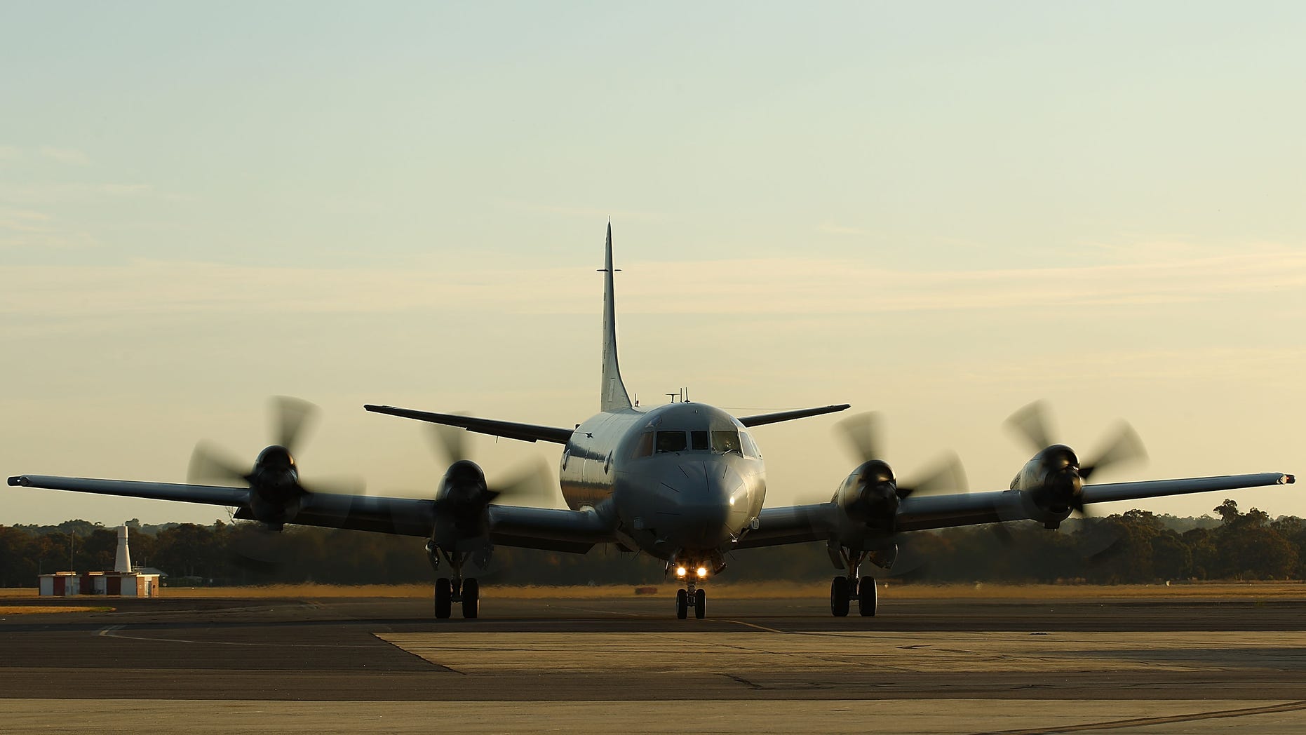 PERTH, AUSTRALIA - APRIL 08: A RAAF P3 Orion taxis from the runway after returning from a search mission for debris from missing Malaysia Airlines flight MH370 at RAAF Base Pearce on April 8, 2014 in Perth, Australia. ACM Angus Houston advised the towed pinger by ADV Ocean Shield is still trying to re-locate the signals previously detected, which were believed to be consistent with aircraft black boxes. The airliner disappeared on March 8 with 239 passengers and crew on board and is suspected to have crashed into the southern Indian Ocean. (Photo by Paul Kane/Getty Images)