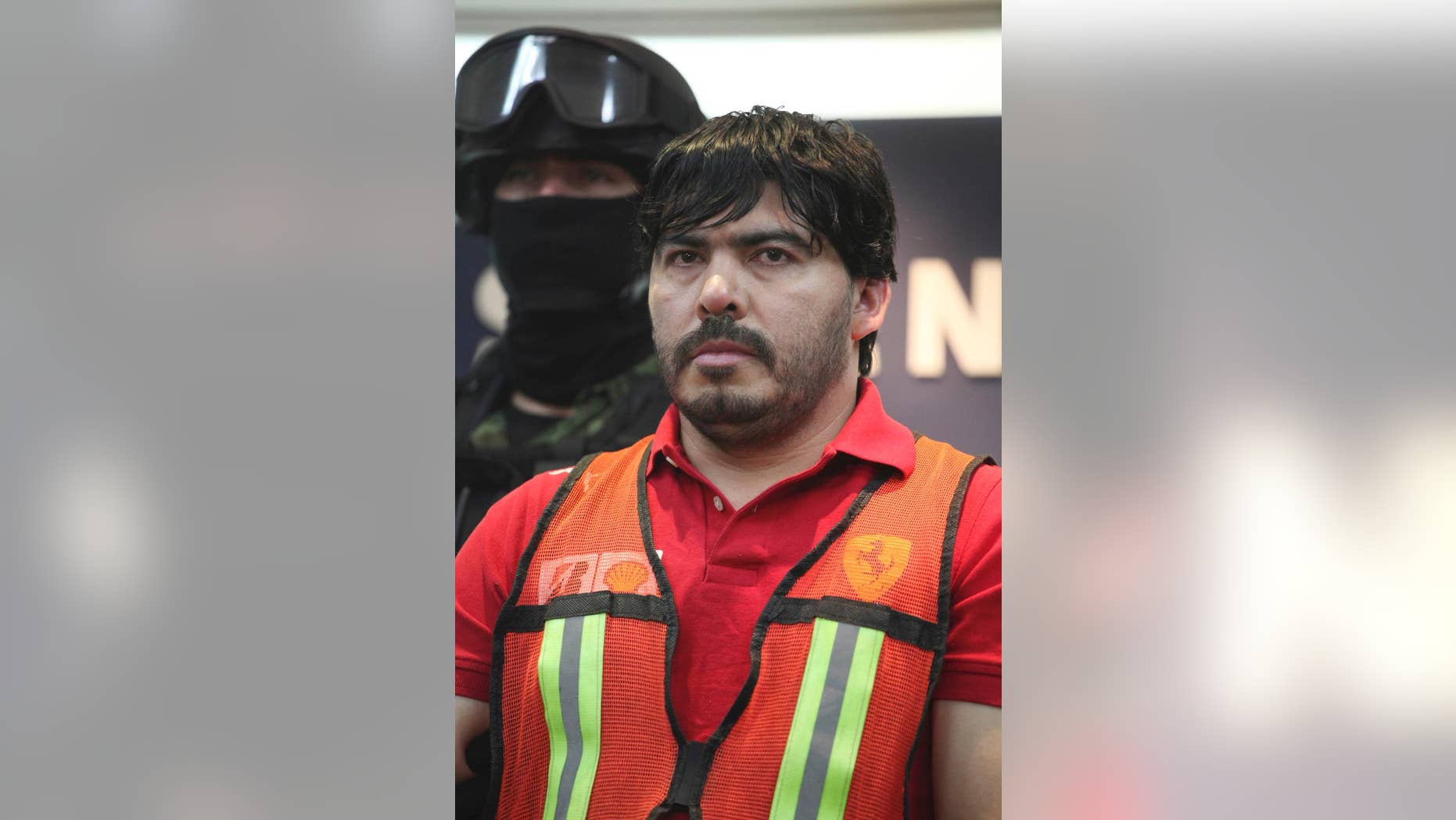 FILE - In this May 13, 2011 file photo, Martin Beltran Coronel, alias “El Aguila,” is presented to the media in Mexico City. A Mexican Federal Judiciary Council said late Wednesday, Sept. 24, 2014, the court has ordered the release of Beltran Coronel, the nephew of deceased Sinaloa drug cartel leader Ignacio Coronel, because of procedural violations, an embarrassment for officials who had portrayed the man as his uncle’s likely successor. Beltran Coronel had been charged with organized crime and the other four faced money laundering charges. (AP Photo/Alexandre Meneghini, File)