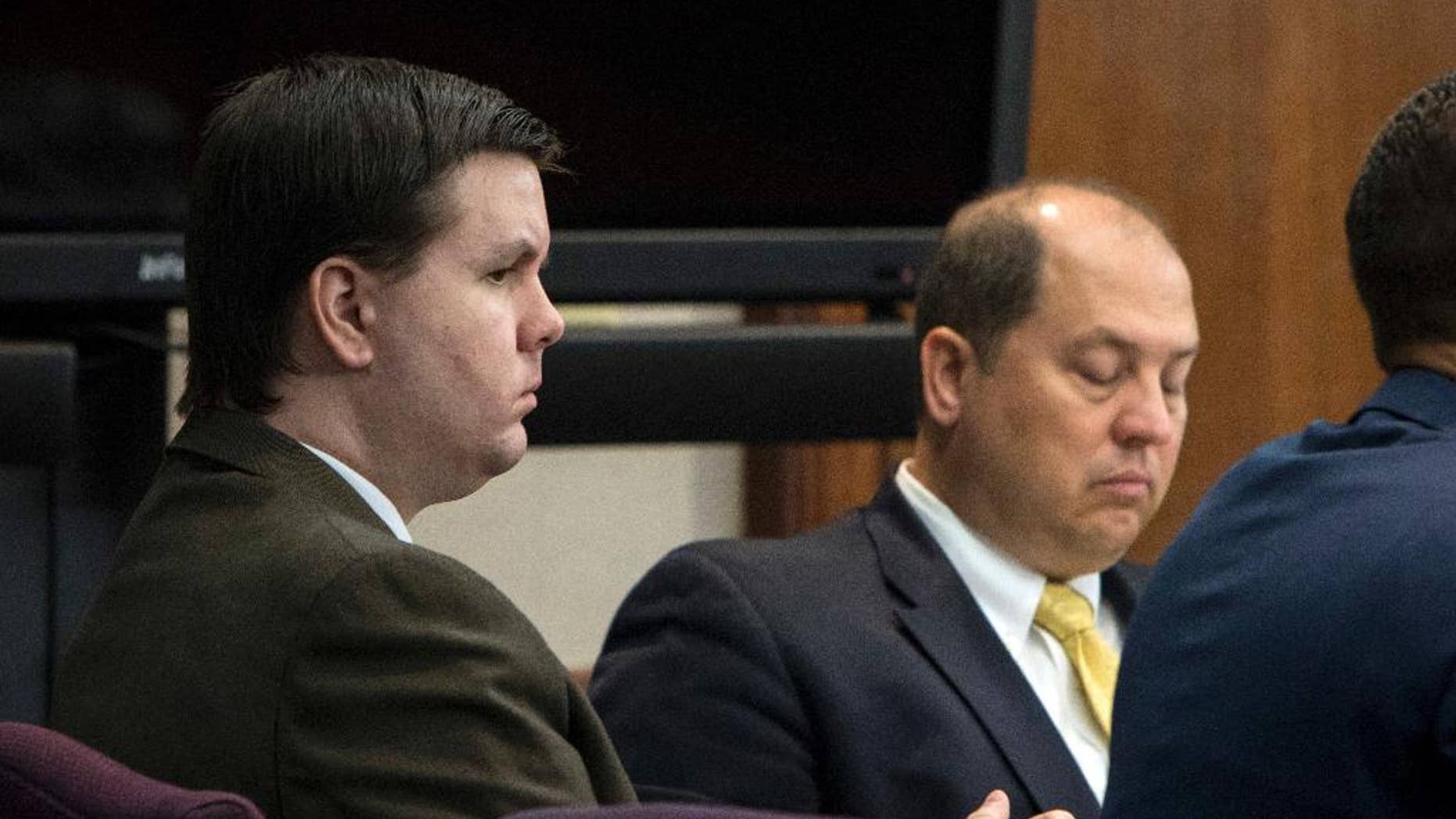 FILE - In this Oct. 3, 2016 file photo, Justin Ross Harris, left, listens to jury selection during his murder trial at the Glynn County Courthouse in Brunswick, Ga. Harris, 34, is charged with murder in the death of his 22-month-old son, Cooper. He's also charged with sending graphic, sexual text messages and photos to a girl for a period of several months when she was 16 and 17. (Stephen B. Morton/Atlanta Journal-Constitution via AP, Pool)
