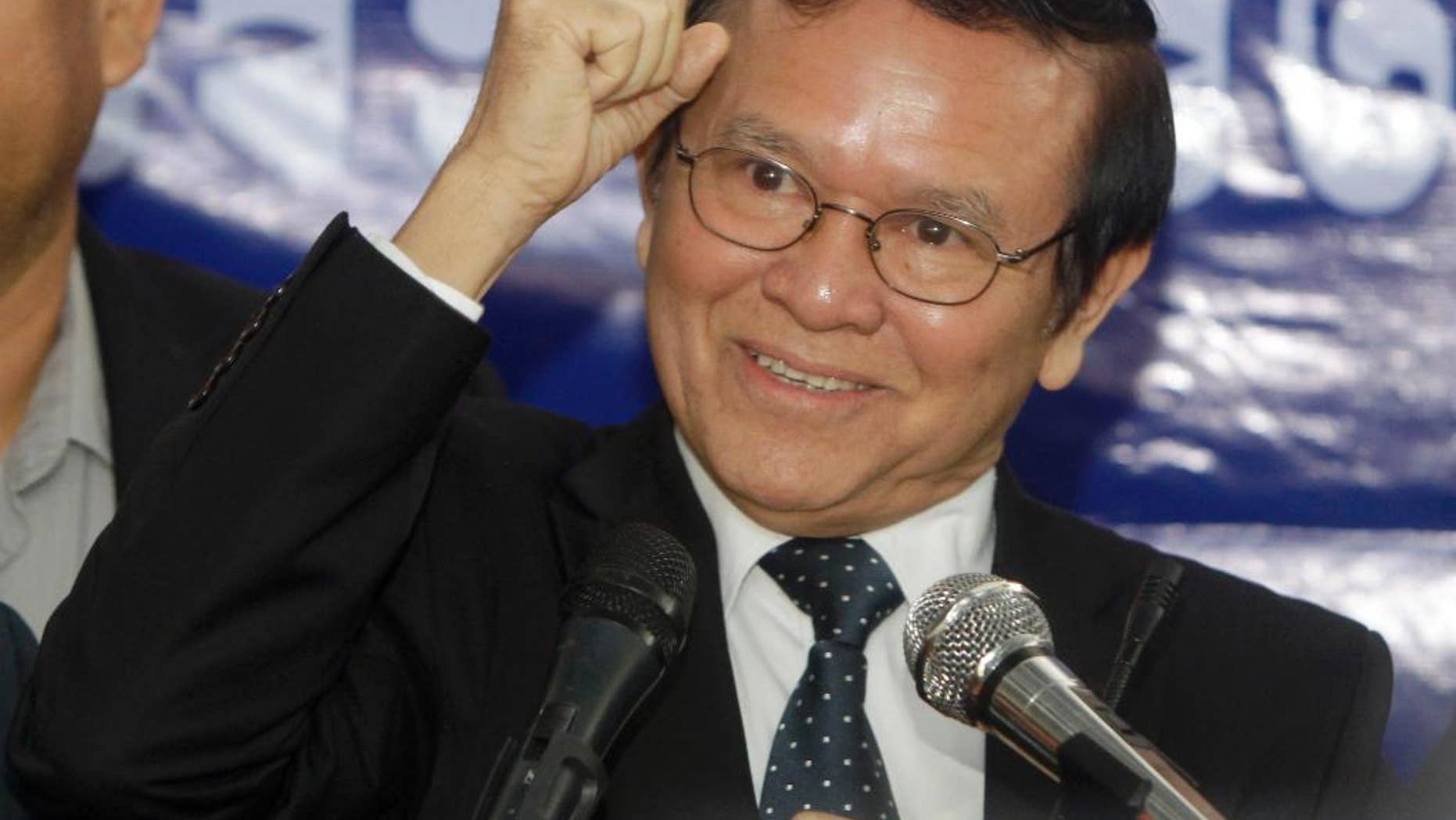 FILE - In this Sept. 9, 2016 file photo, Kem Sokha, deputy leader of the Cambodia National Rescue Party, gestures as he speaks at the party's headquarters in Phnom Penh, Cambodia. Executive members of Cambodia's beleaguered opposition party have accepted the resignation of Sam Rainsy, its charismatic leader, and named his deputy, Kem Sokha, acting chief until a party congress can be held. (AP Photo/Heng Sinith, File)
