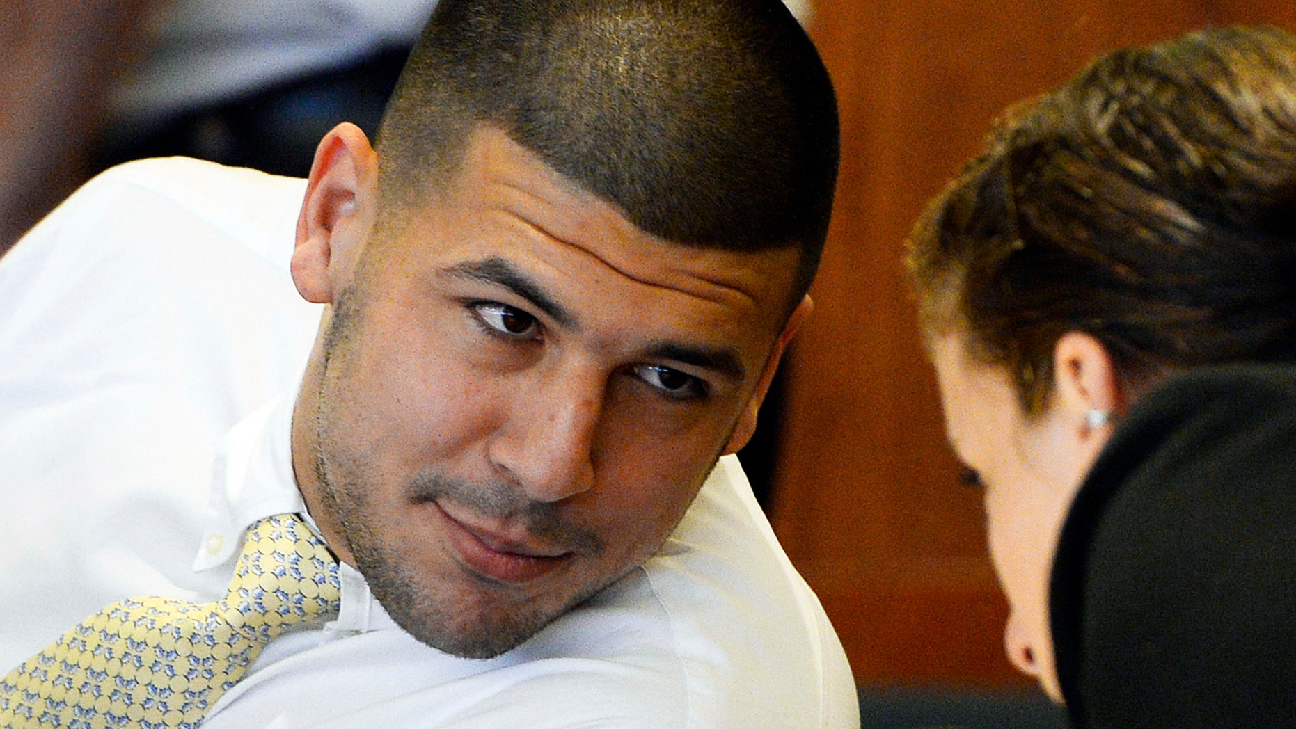 FILE - In this Oct. 2, 2014 file photo, former New England Patriots NFL football player Aaron Hernandez attends an evidentiary hearing at Bristol County Superior Court in Fall River, Mass. Hernandez has pleaded not guilty to first-degree murder in the 2013 shooting death of Odin Lloyd, a Boston semi-professional football player who was dating the sister of Hernandez's fiancee. Hernandez is due back in Bristol Superior Court for a pre-trial hearing Friday, Dec. 12, 2104, less than a month before jury selection in the trial is scheduled to begin. (AP Photo/CJ Gunther, Pool)