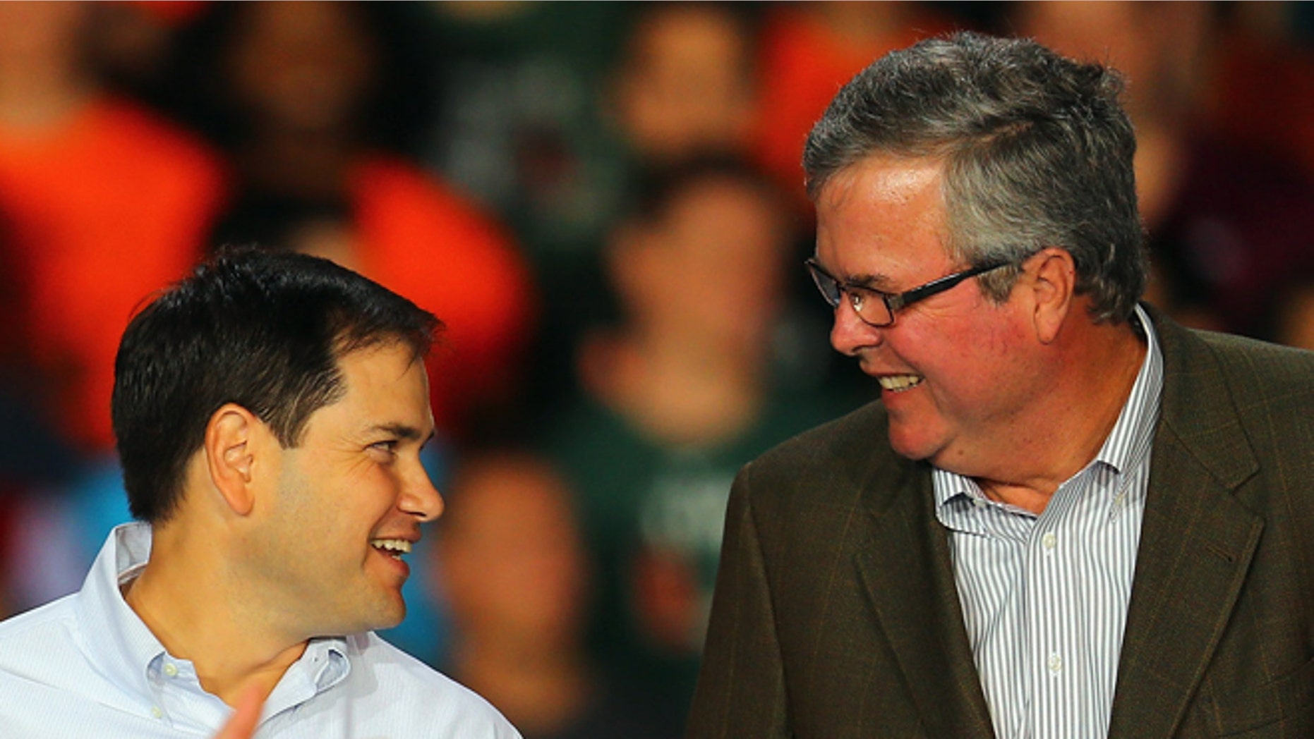 MIAMI, FL - OCTOBER 31: Republican presidential candidate, former Massachusetts Gov. Mitt Romney speaks as Sen. Marco Rubio (R-FL) (C) and former Florida Gov. Jeb Bush stand next to him during a campaign rally at the BankUnited Center on the campus of the University of Miami on October 31, 2012 in Miami, Florida. In the wake of Hurricane Sandy which hit the northeastern part of the United States, Romney is back to campaigning before the general election on November 6. (Photo by Joe Raedle/Getty Images)