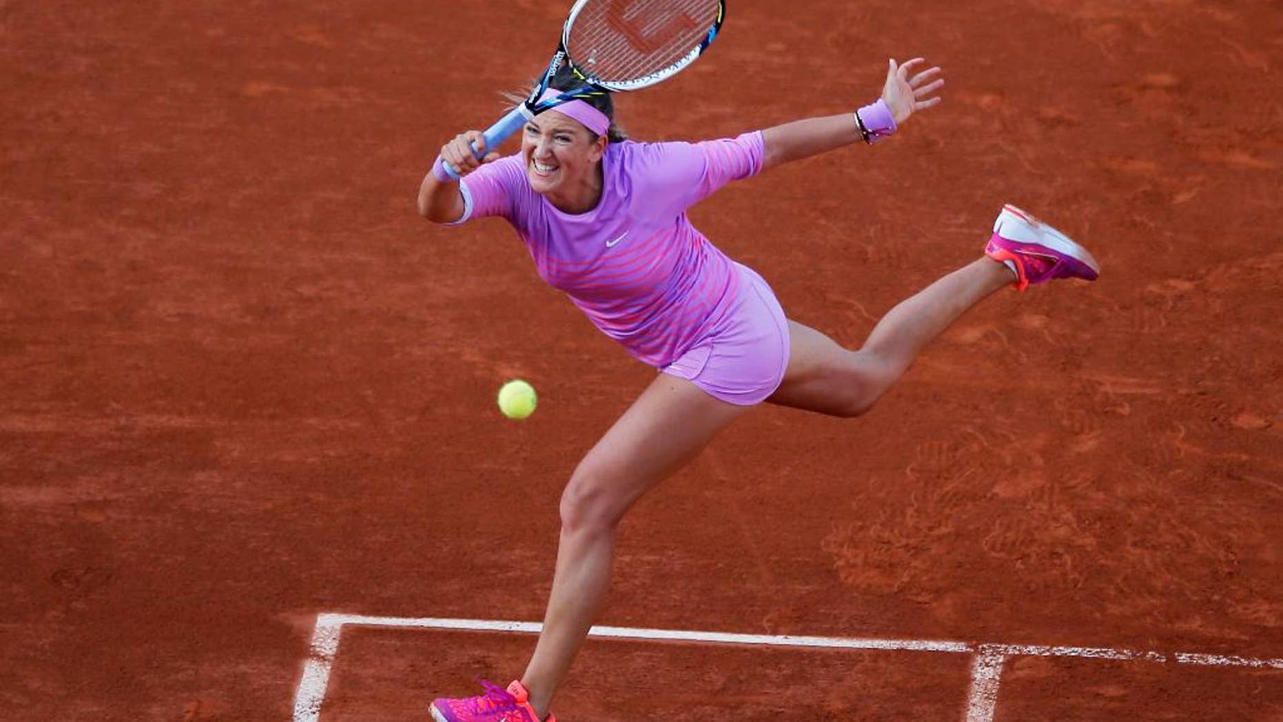 FILE - In this May 30, 2015, file photo, Victoria Azarenka of Belarus returns in the third round match of the French Open tennis tournament against Serena Williams at Roland Garros stadium, in Paris. Azarenka says she is pregnant and plans to resume her career after the baby is born. The 26-year-old Azarenka posted a letter on her Twitter account Friday, July 15, 2016, saying that when she was recovering from the knee injury that kept her out of Wimbledon, she and her boyfriend learned they were expecting a child at the end of the year. (AP Photo/Francois Mori, File)