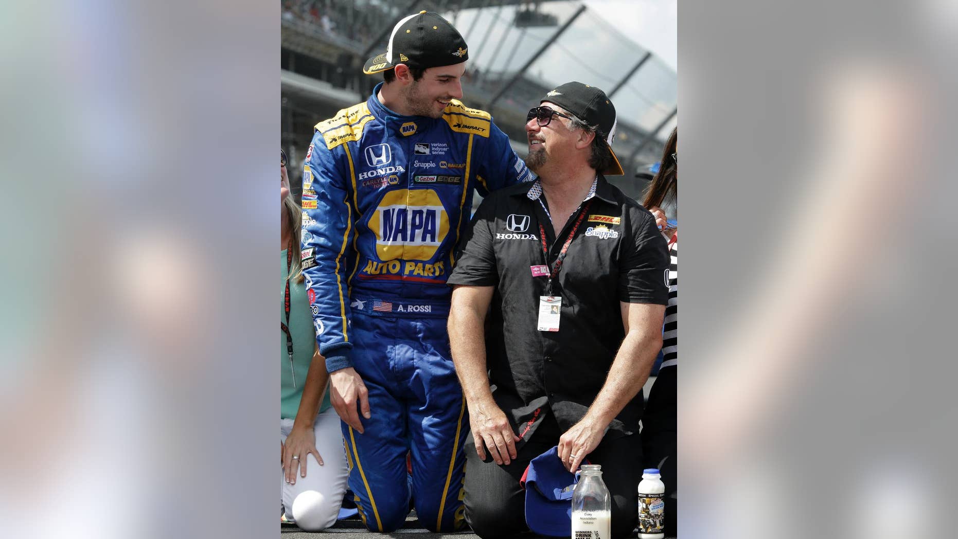 FILE - In this Sunday, May 29, 2016, file photo, Alexander Rossi, left, celebrates with car owner Michael Andretti after winning the 100th running of the Indianapolis 500 auto race at Indianapolis Motor Speedway in Indianapolis. Michael Andretti is the greatest driver to never win the Indianapolis 500. He has done it four times as a car owner, though, most recently on Sunday with Rossi. It can be a bitter pill to swallow to watch a rookie win a race your family has chased for over 40 years, but Andretti harbored no jealousy over Rossi's improbable victory. (AP Photo/R Brent Smith)