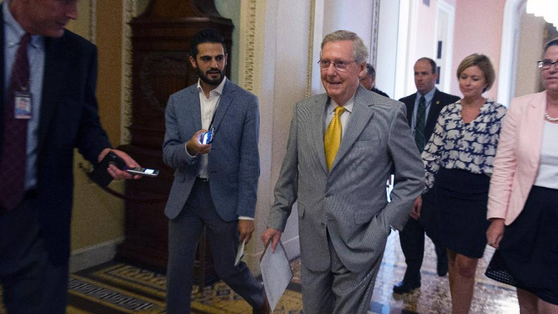 Senate Majority Leader Mitch McConnell, R-Ky., walks to the Senate Chamber to begin a special session to extend surveillance programs, in Washington, Sunday, May 31, 2015. The Senate was unable to make a deal to extend contested anti-terror provisions and as a result, the post-Sept. 11 programs expired at midnight Sunday. (AP Photo/Cliff Owen)